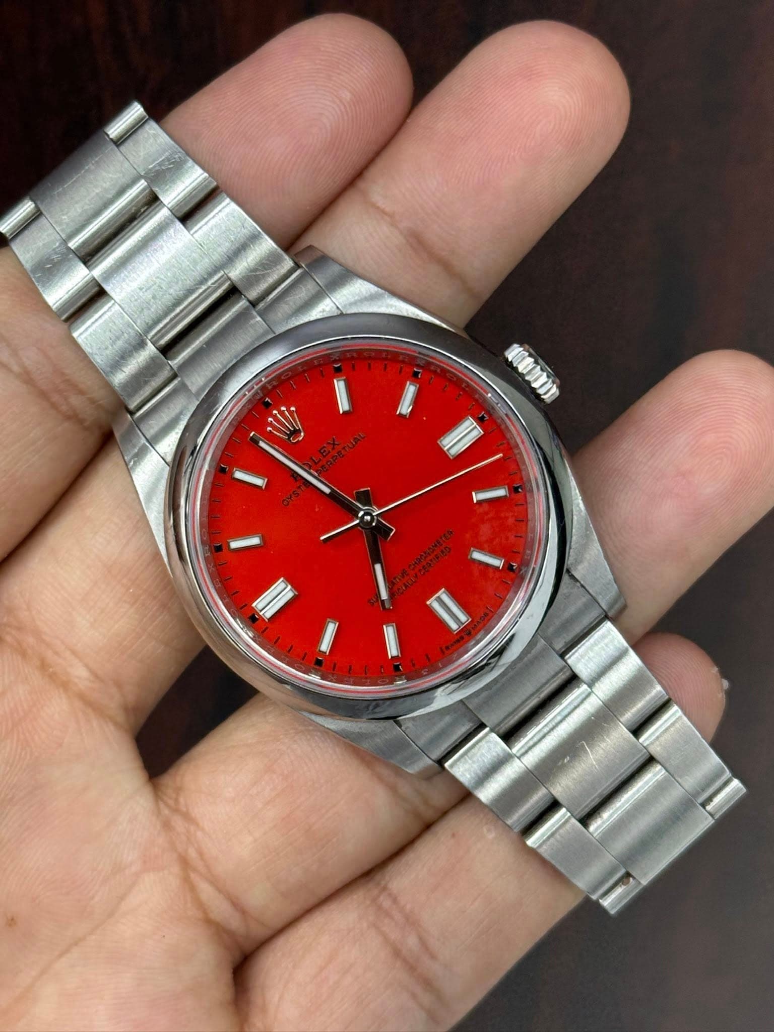 May be an image of wrist watch and text