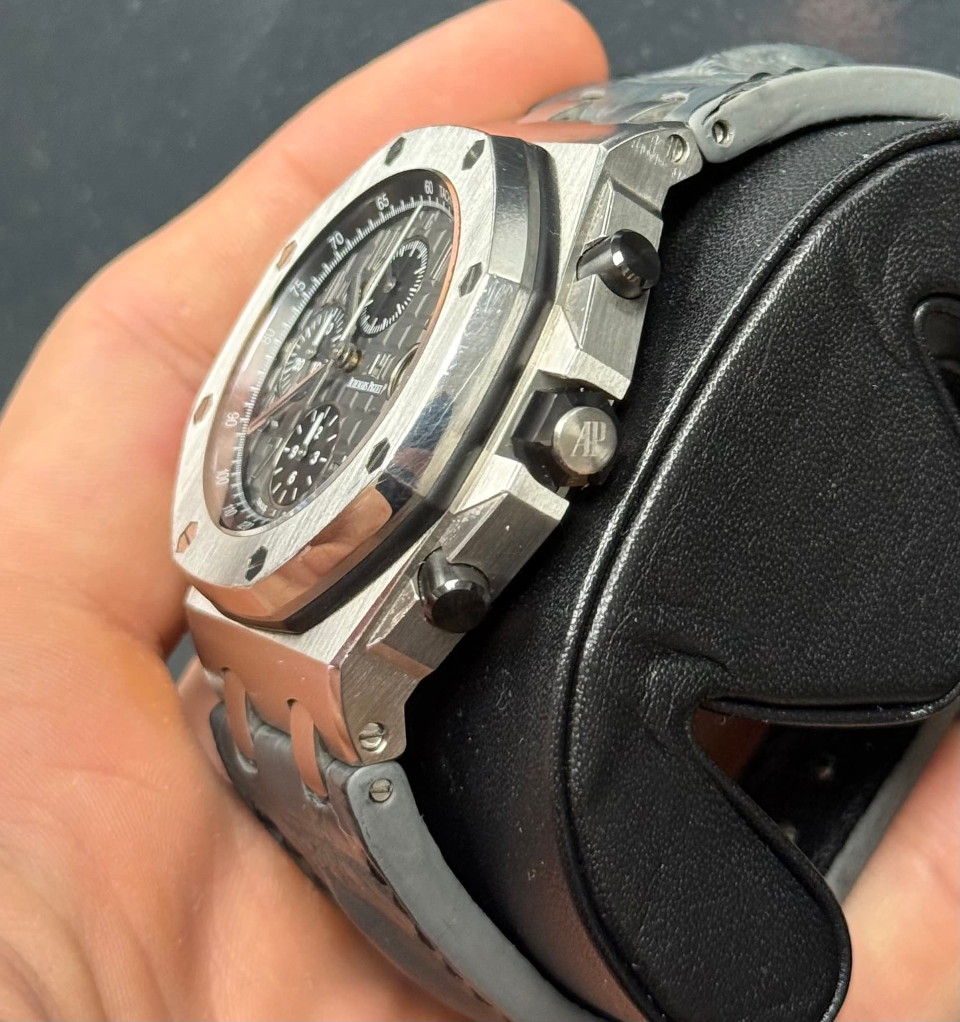 May be an image of wrist watch and text