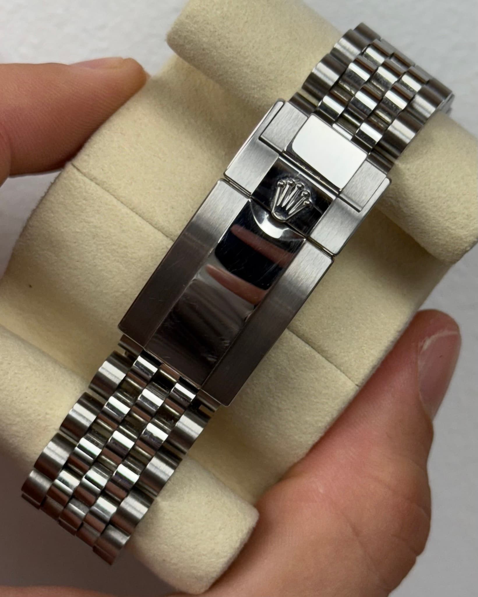 May be an image of wrist watch and text