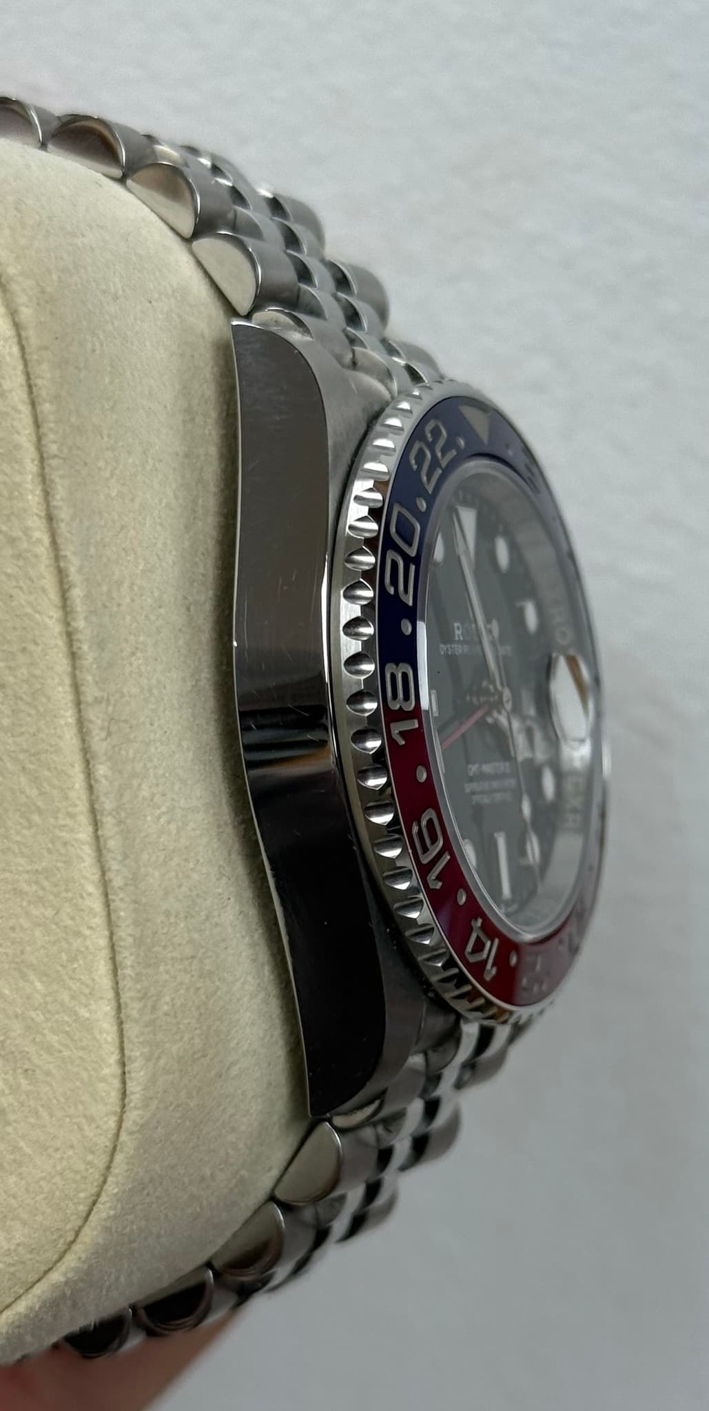 May be an image of wrist watch and text