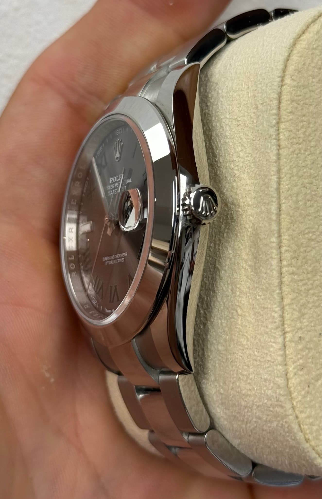 May be an image of wrist watch and text