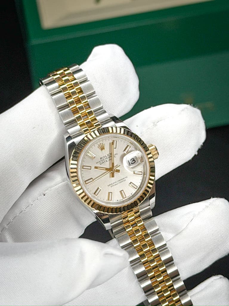 May be an image of wrist watch and text