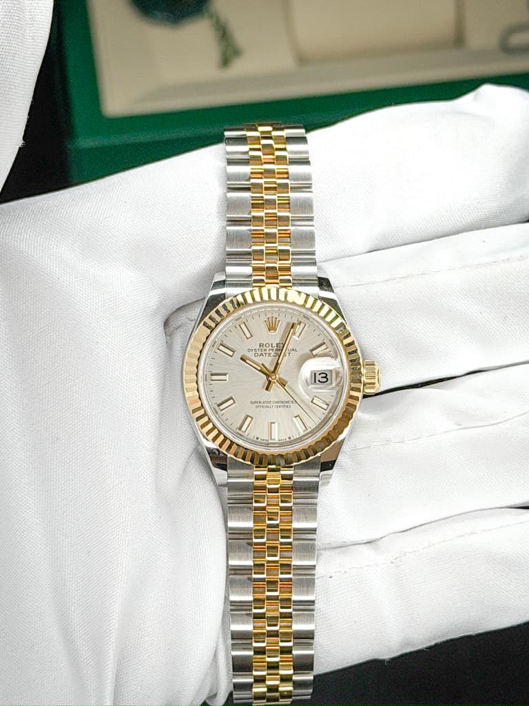 May be an image of wrist watch and text