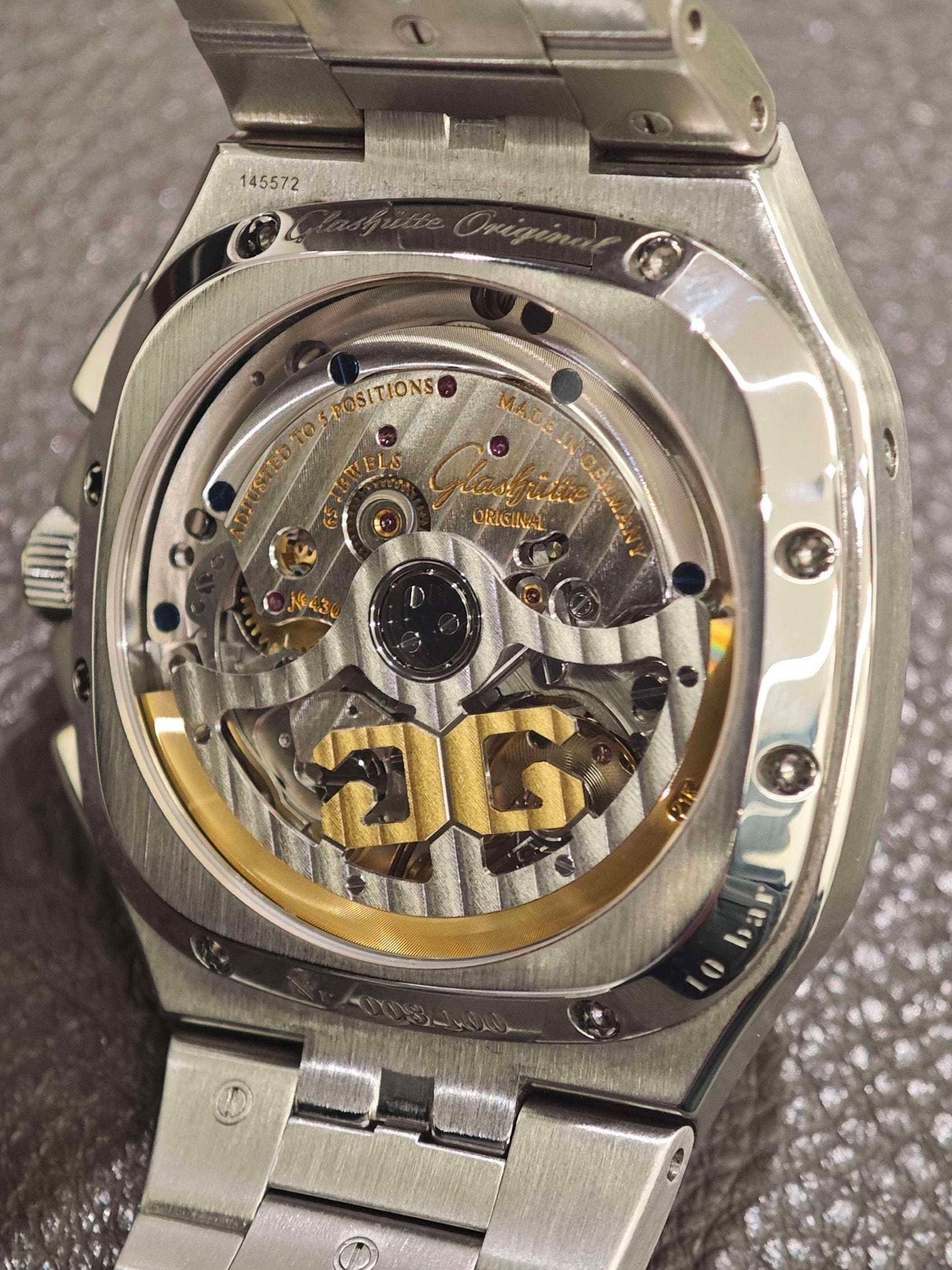 May be an image of wrist watch and text