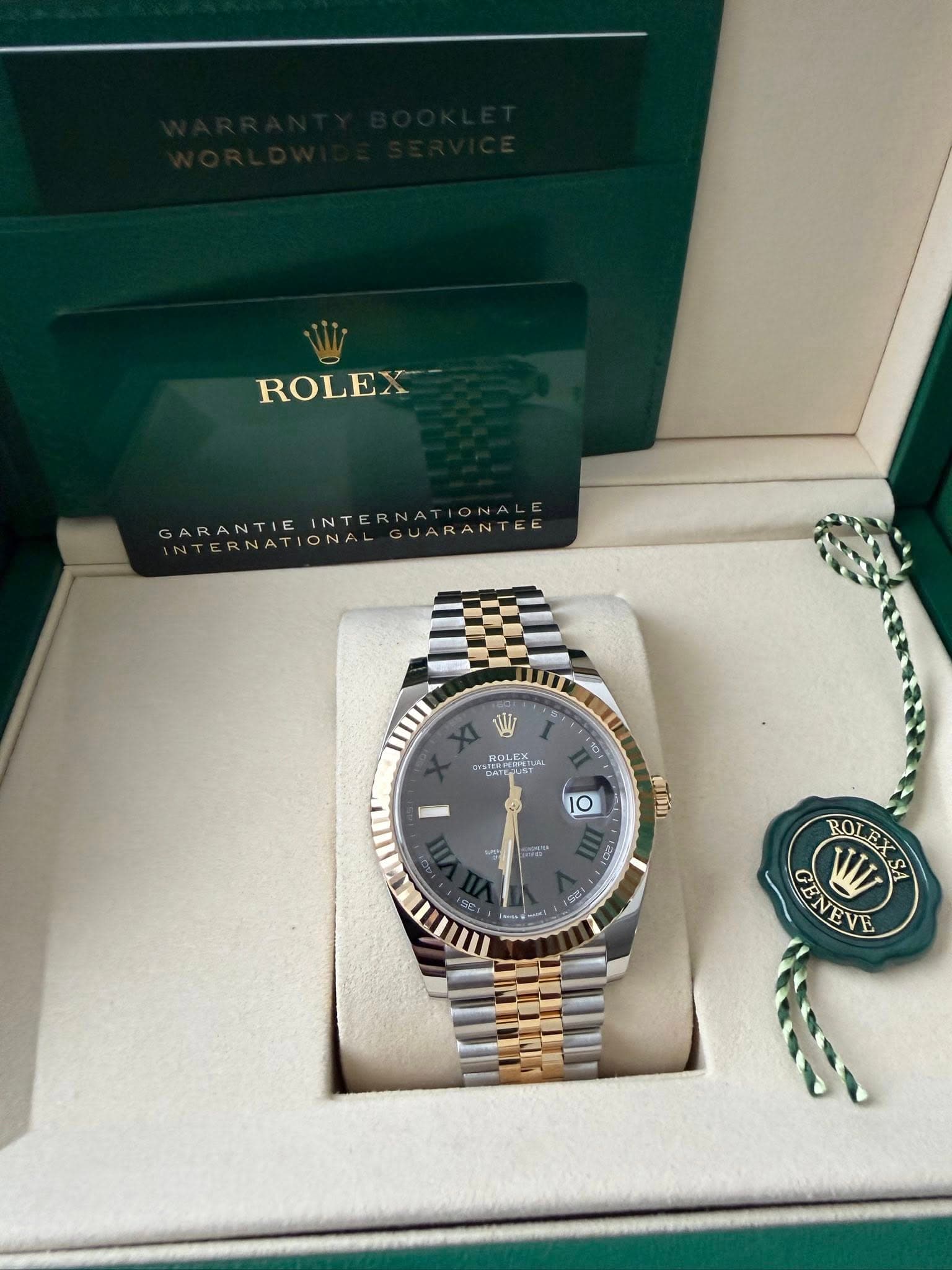 May be an image of wrist watch and text