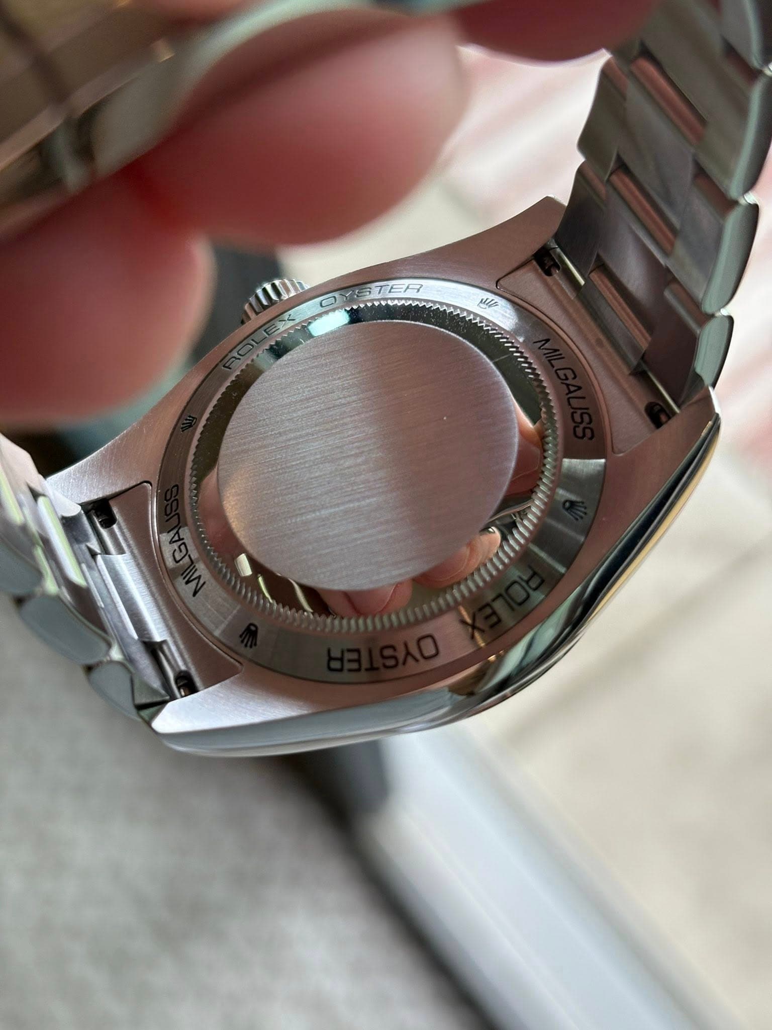 May be an image of wrist watch and text