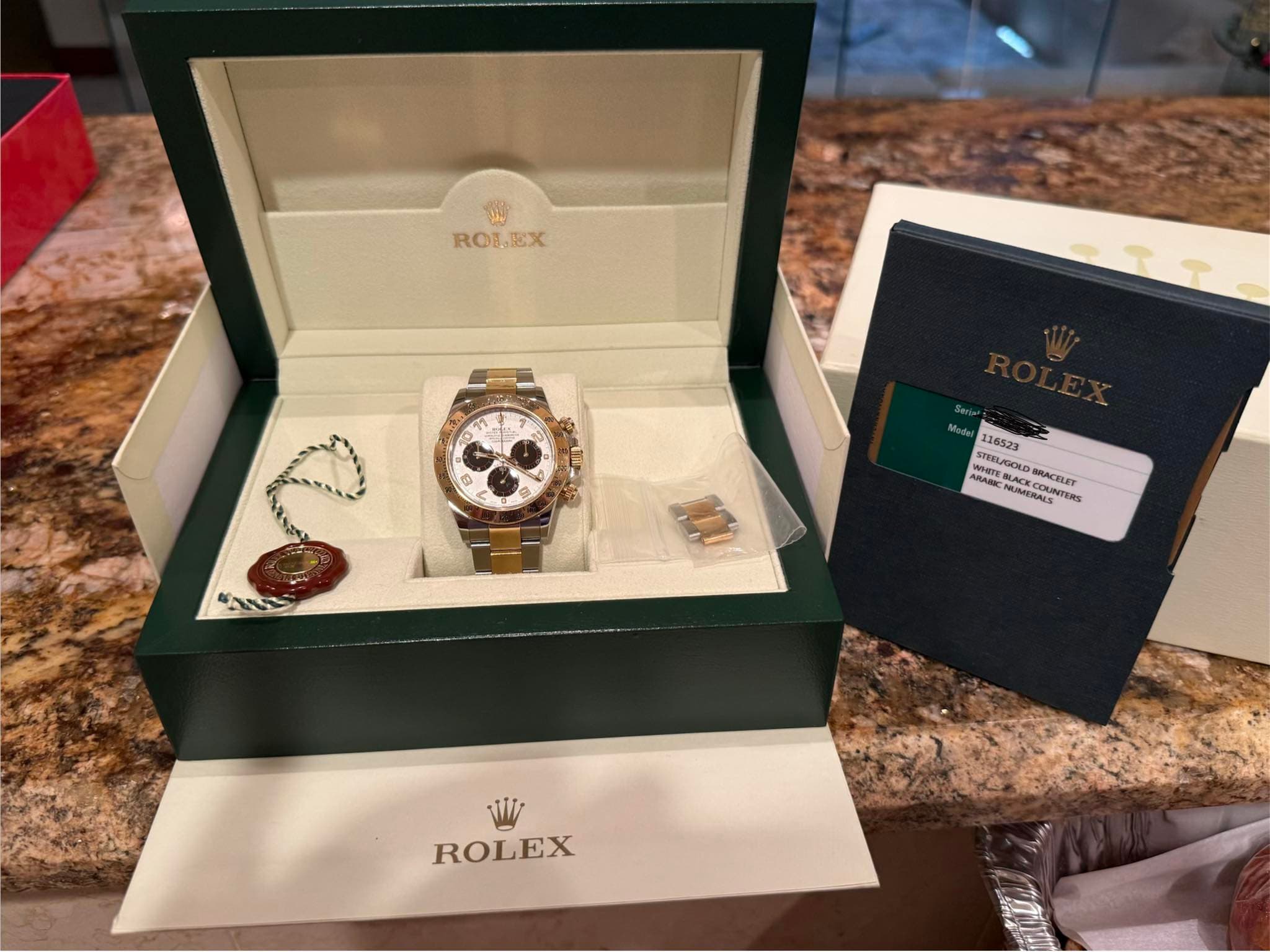 May be an image of wrist watch and text