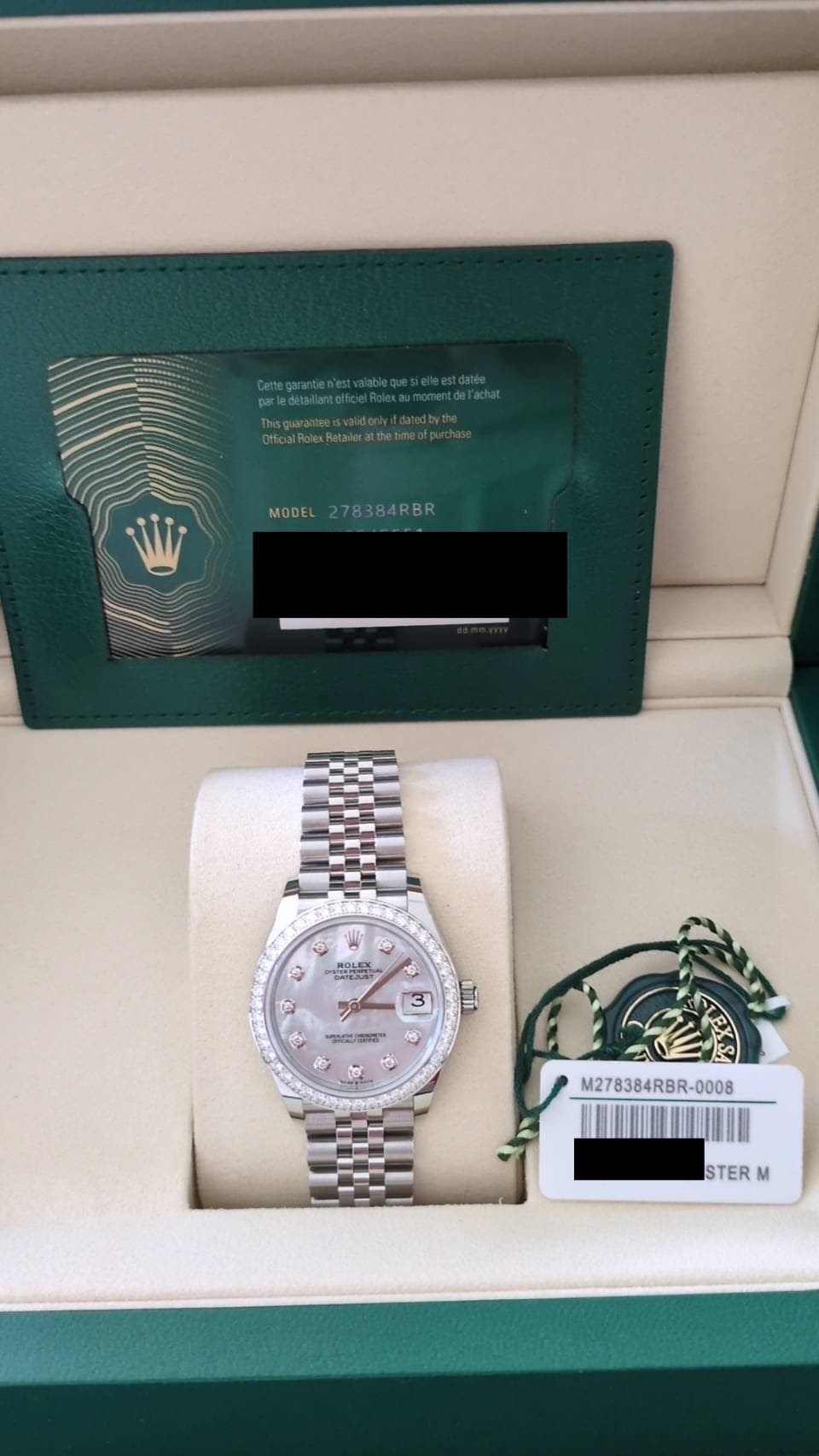 May be an image of wrist watch and text
