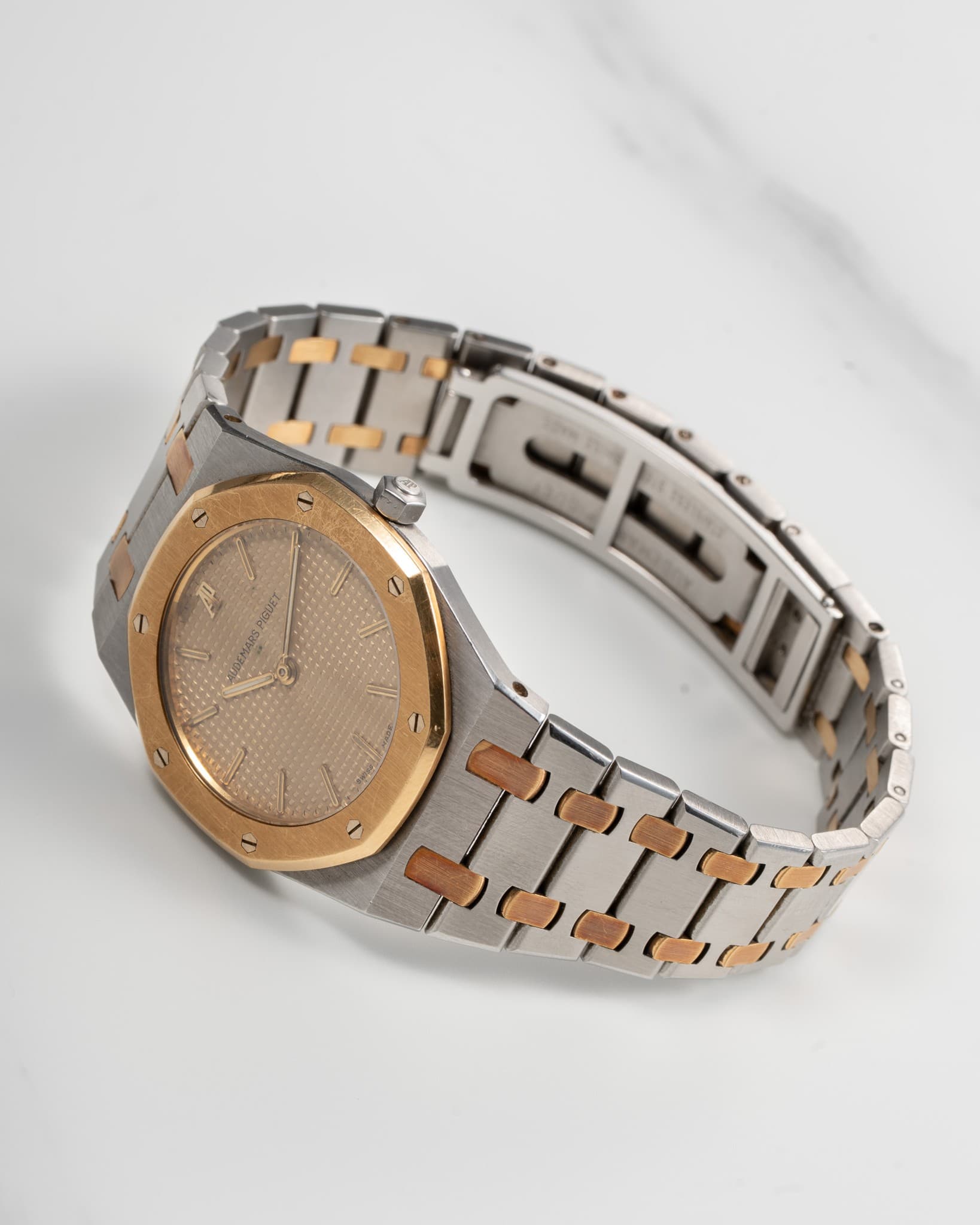 May be an image of wrist watch, jewelry and text