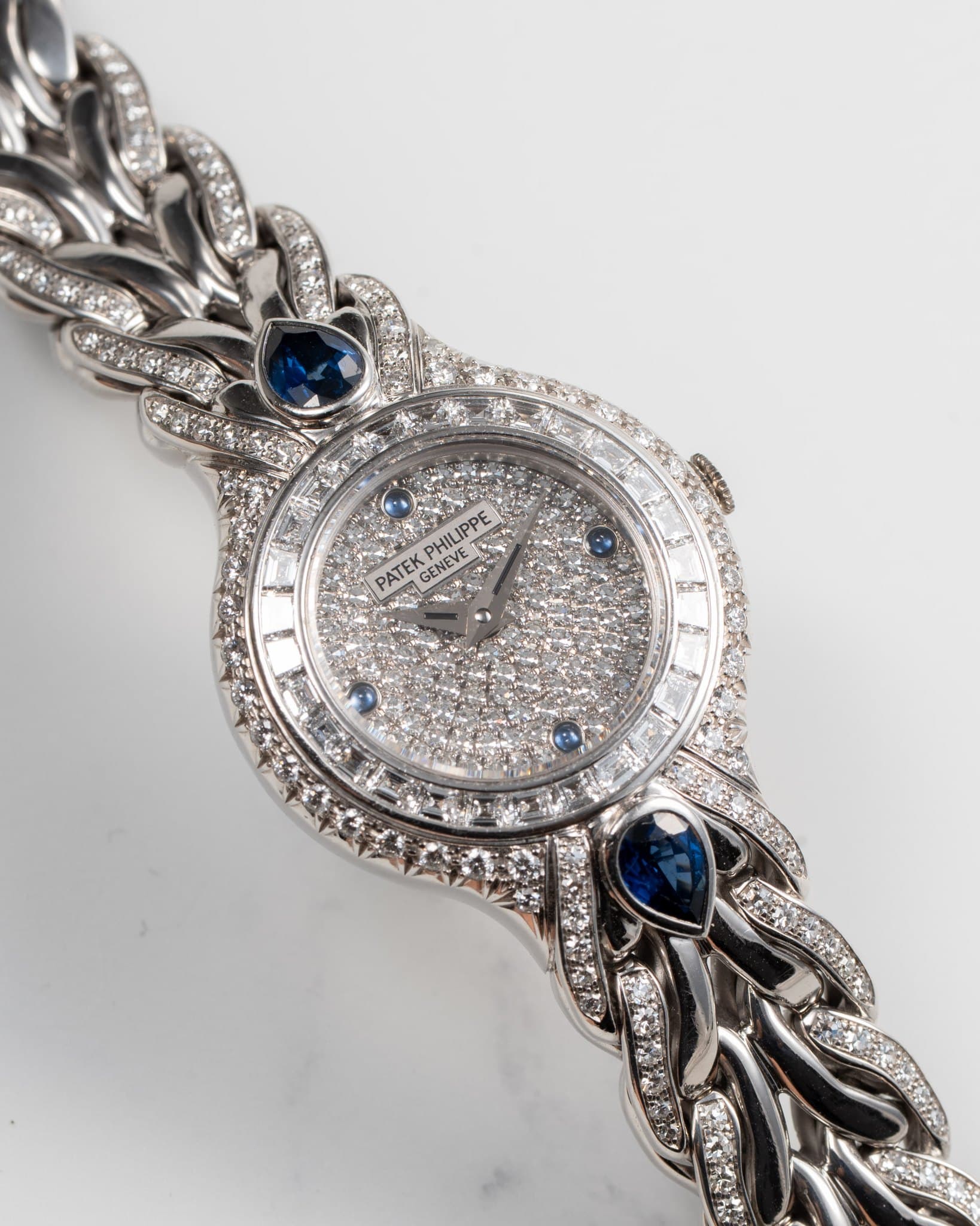 May be an image of wrist watch and jewelry