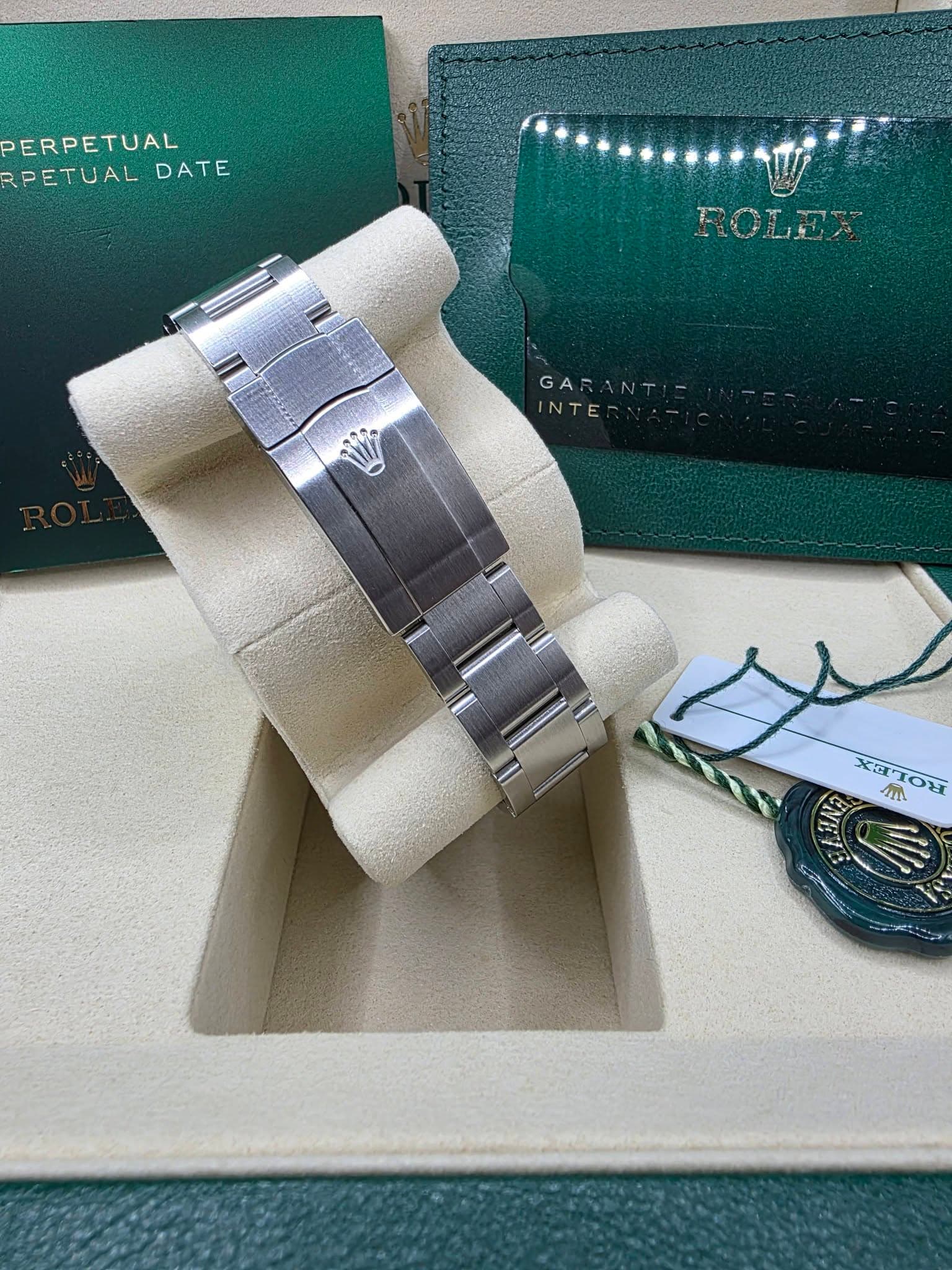May be an image of wrist watch, napkin ring and text