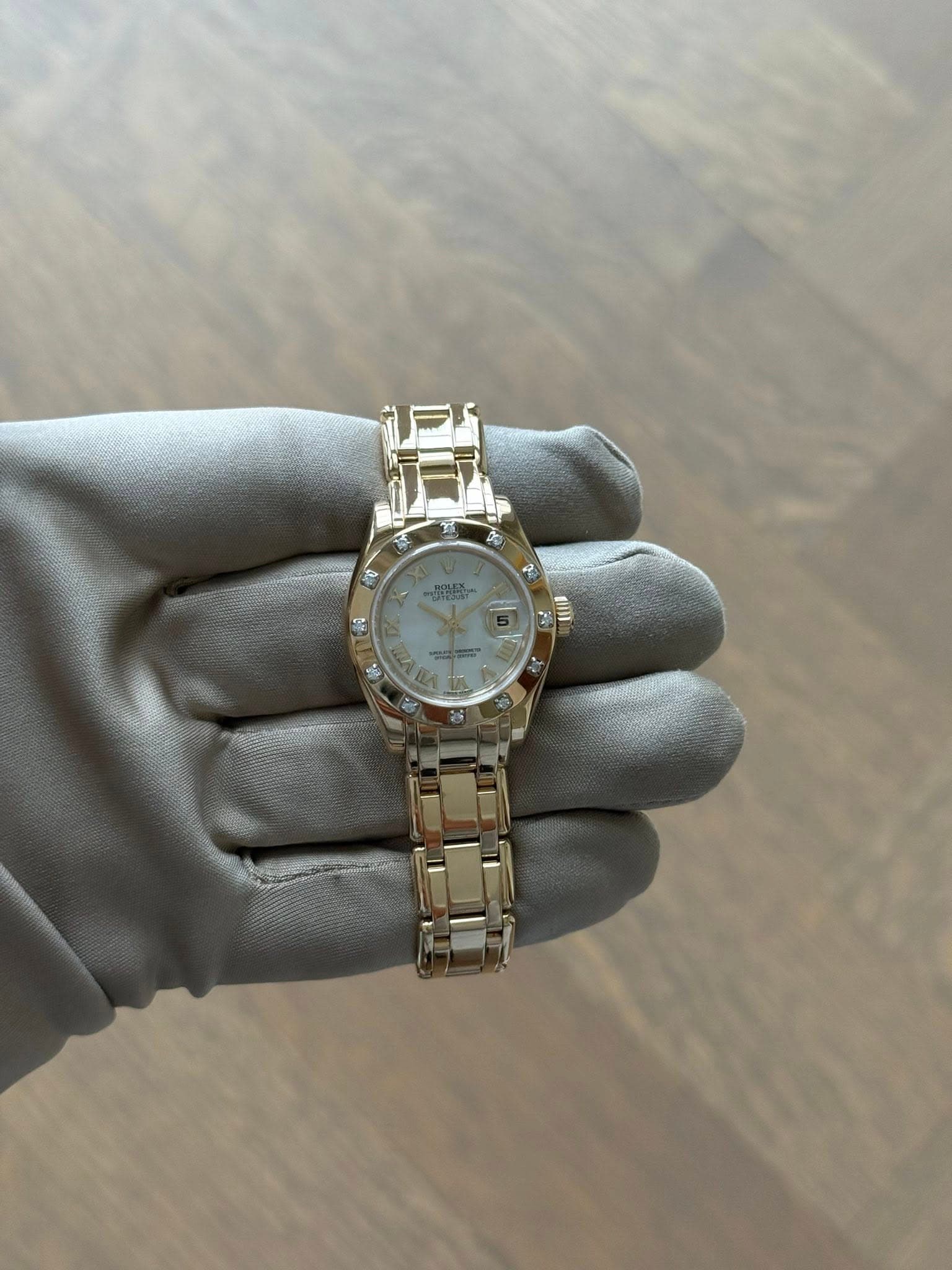 May be an image of wrist watch and text