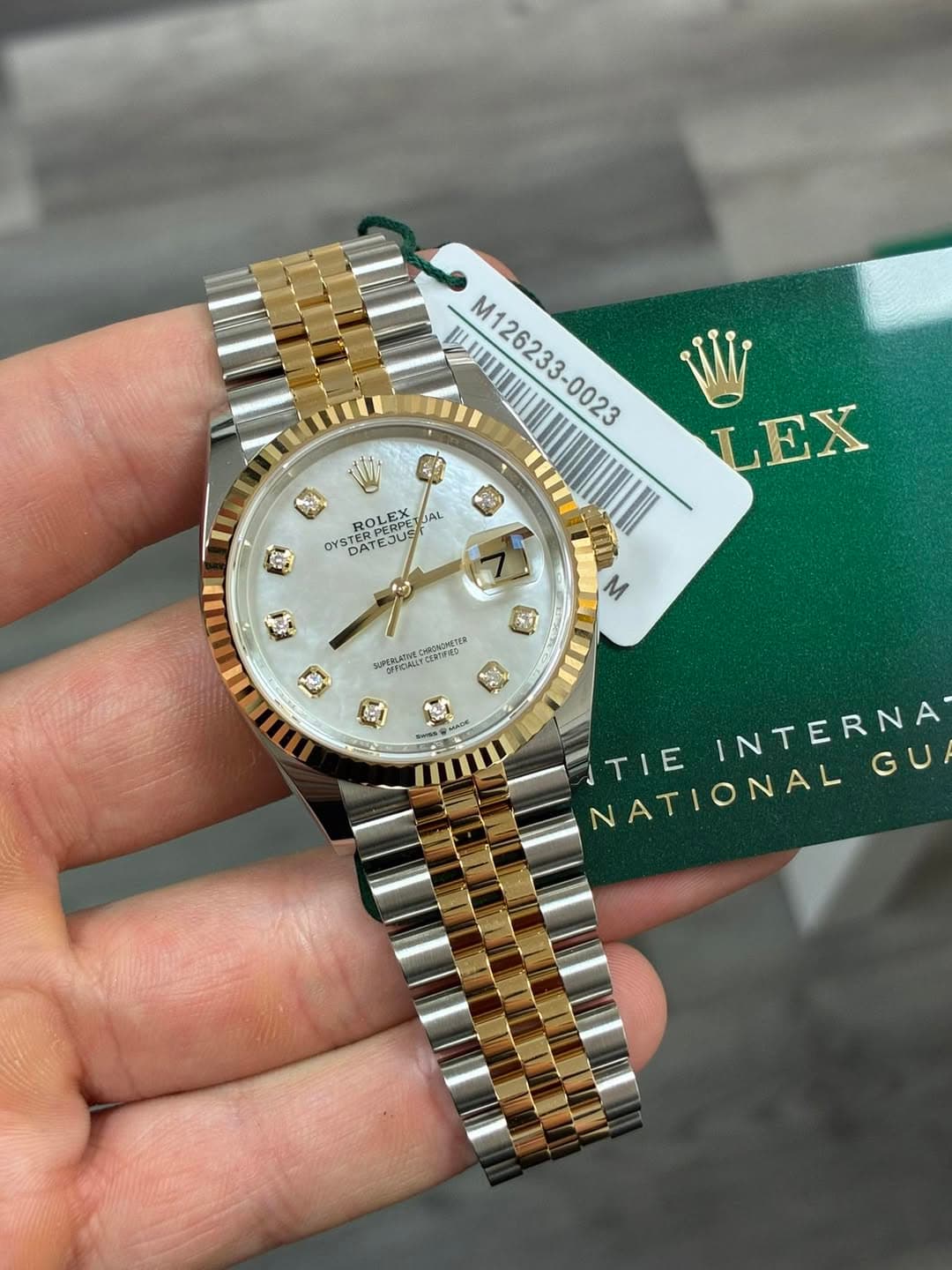 May be an image of wrist watch and text