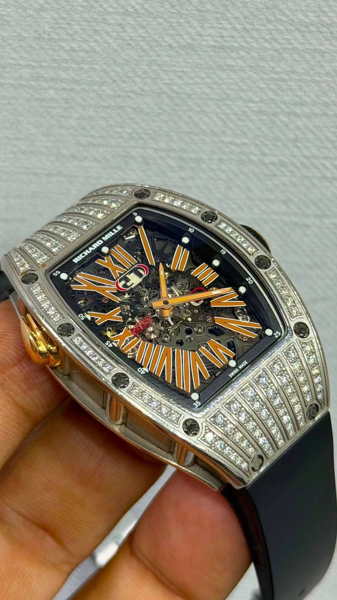 May be an image of wrist watch and text