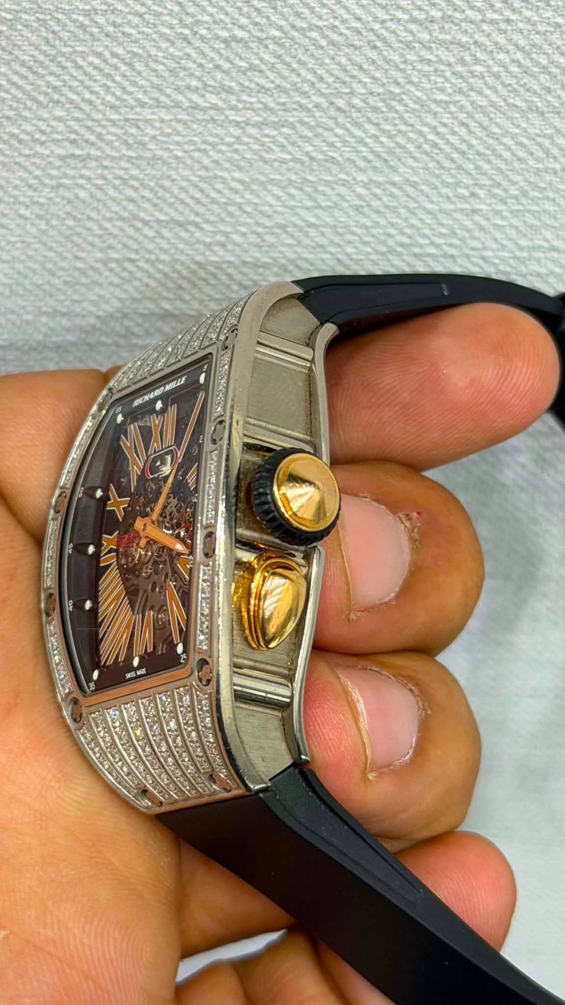 May be an image of wrist watch and text