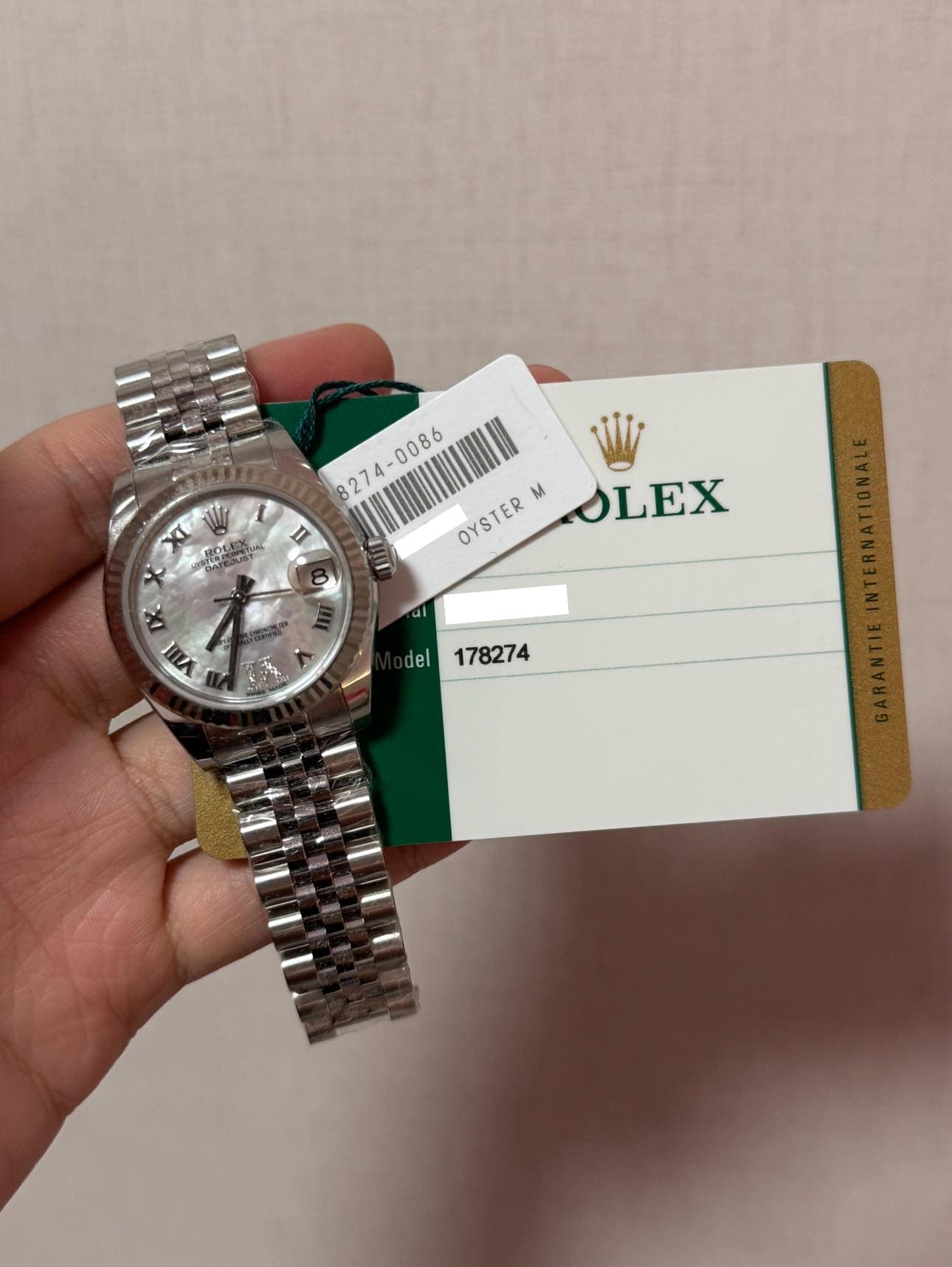 May be an image of wrist watch and text that says ' Η OITER"OLEX OYSTER OYSTER m OLEX al IV del 178274'