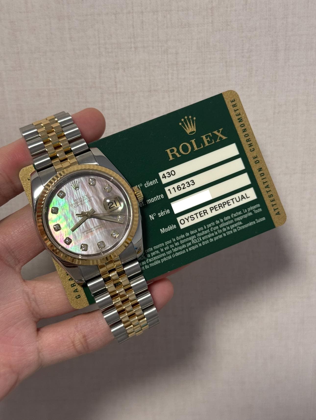 May be an image of wrist watch and text