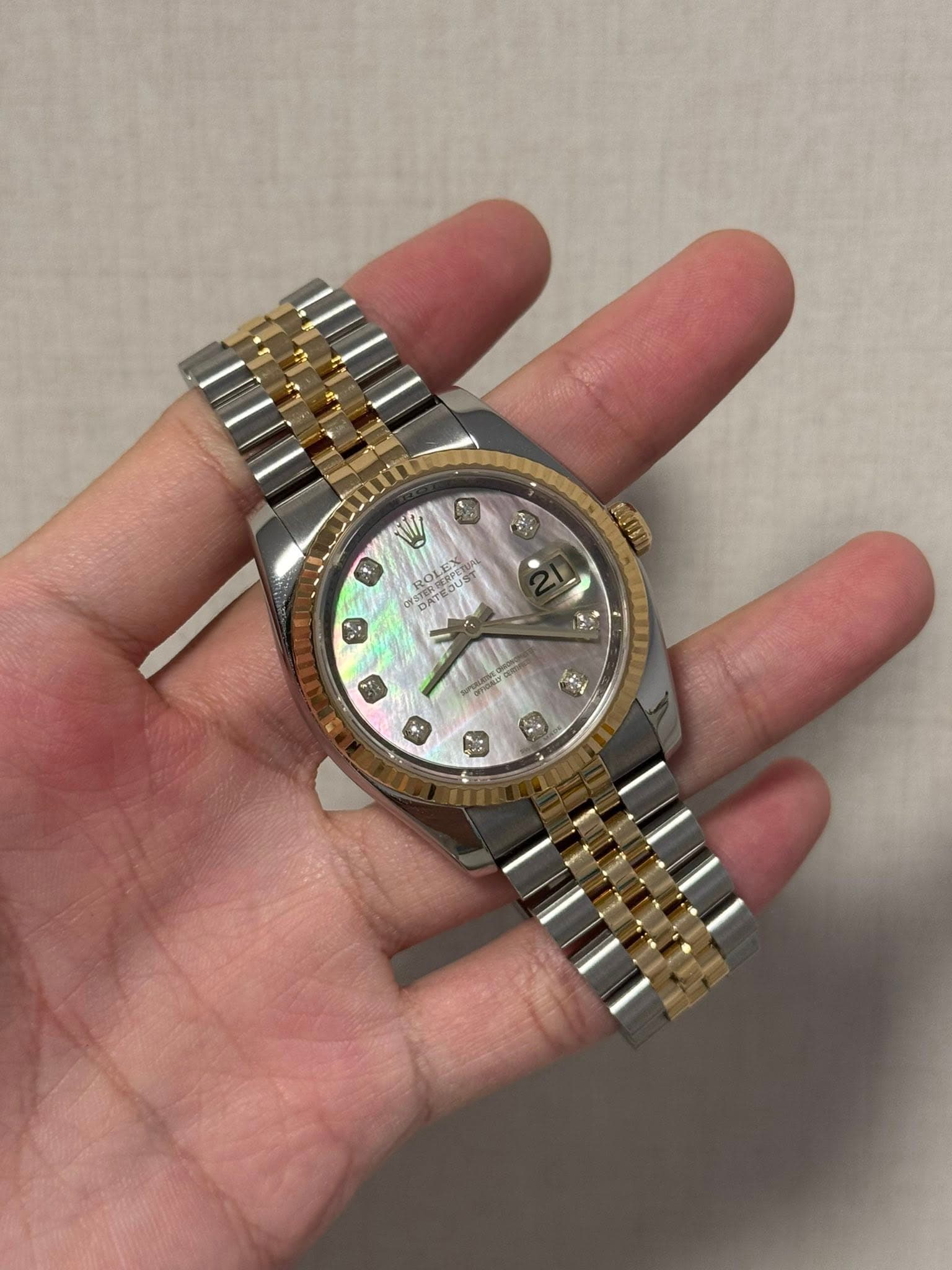 May be an image of wrist watch and text