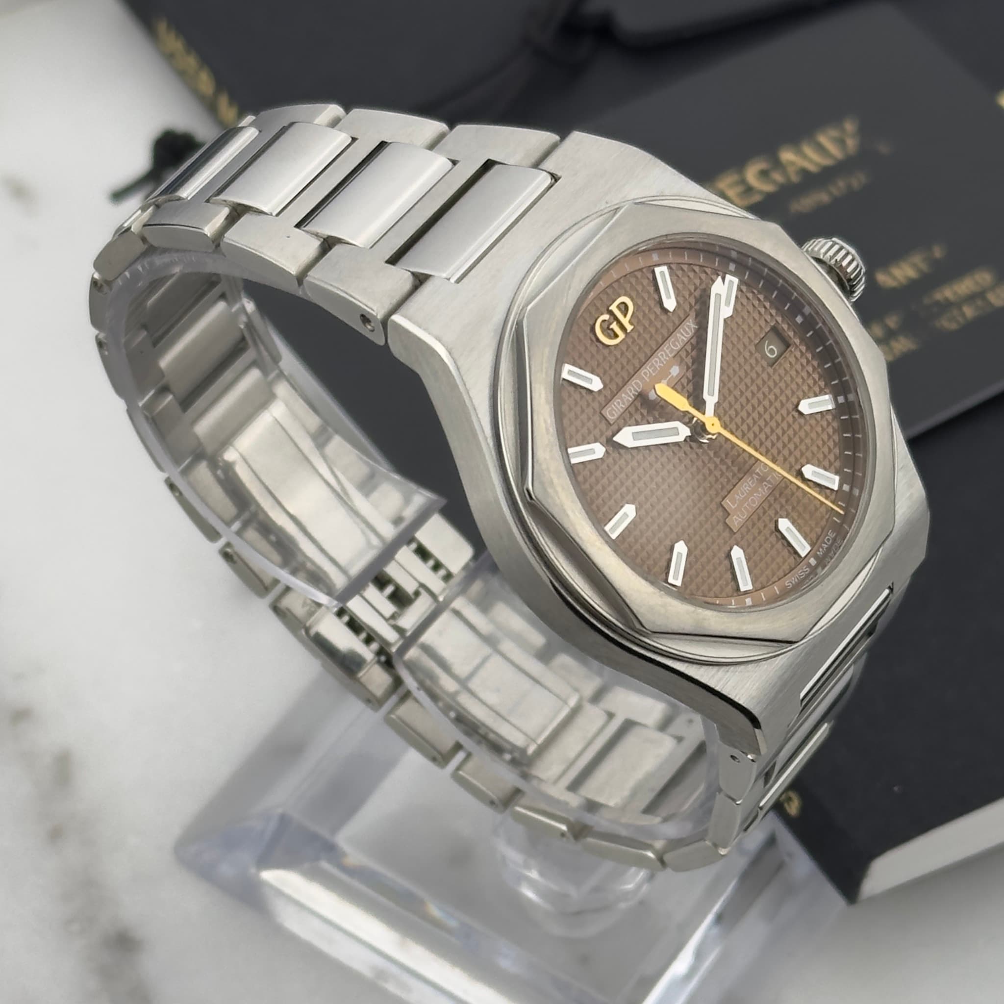 May be an image of wrist watch and text