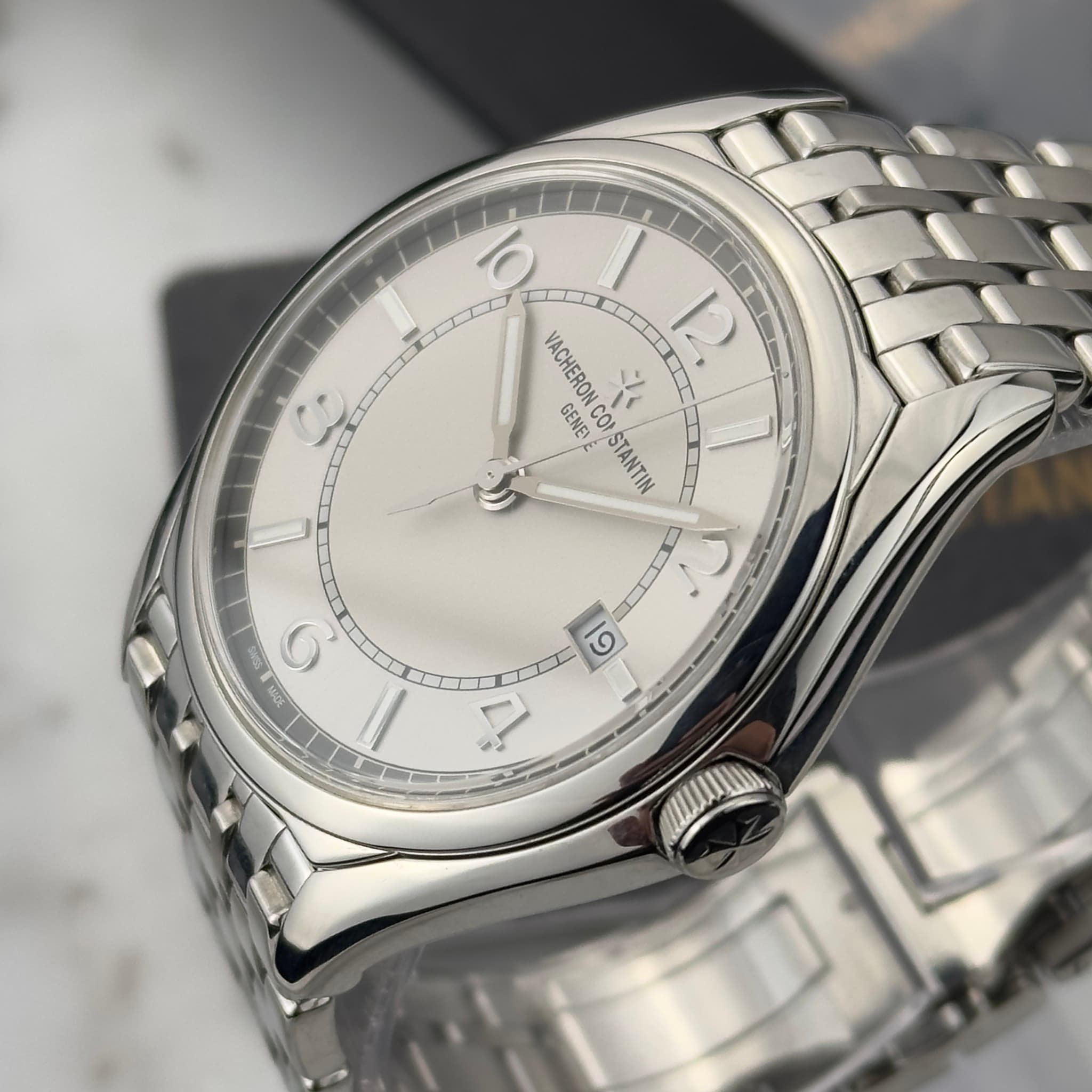 May be an image of wrist watch and text