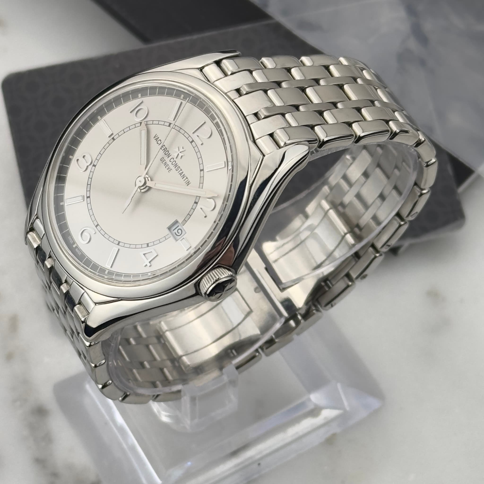 May be an image of wrist watch and text