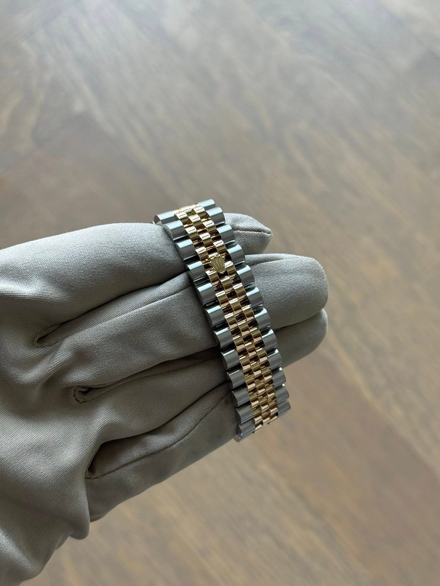 May be an image of wrist watch and jewelry