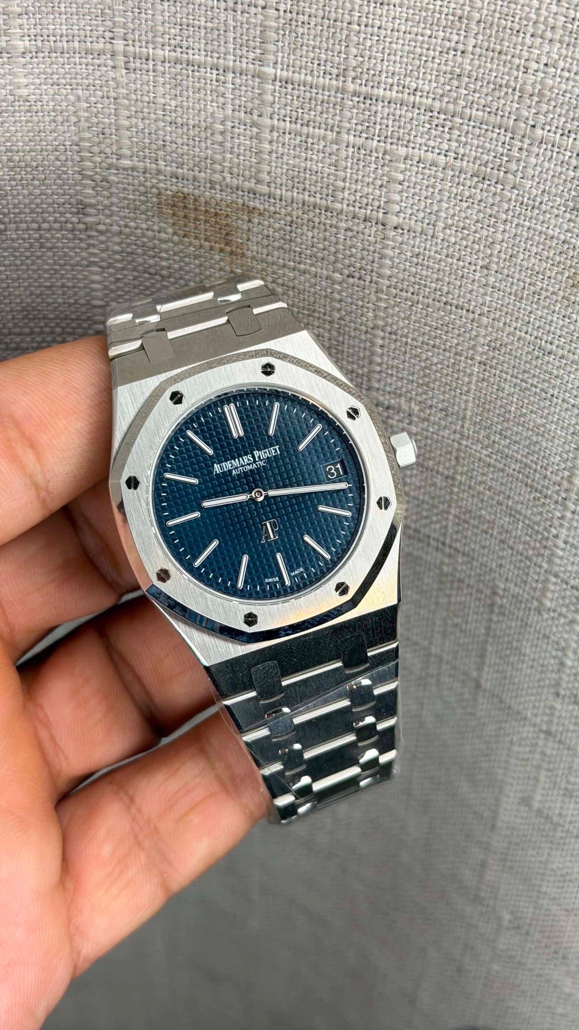 May be an image of wrist watch and text