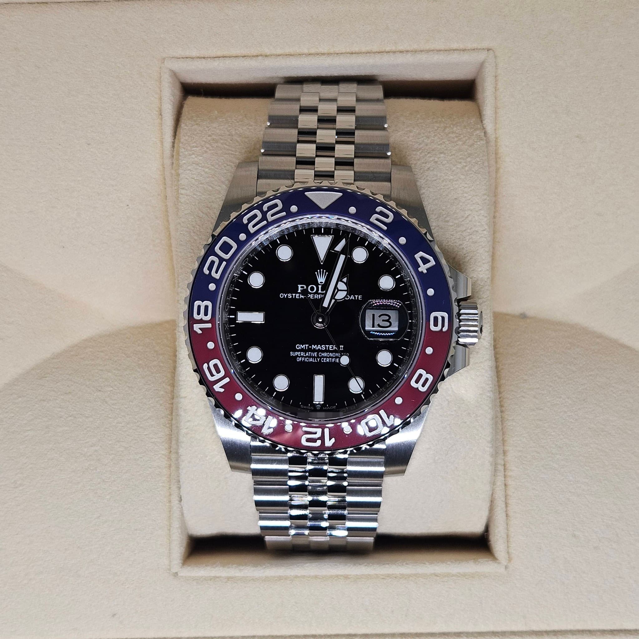 May be an image of wrist watch and text
