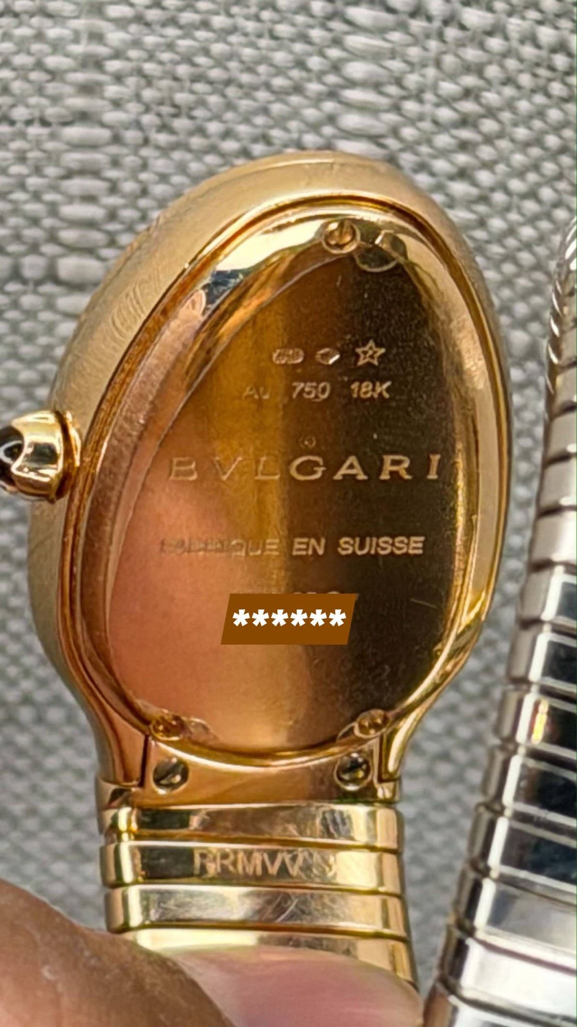May be an image of wrist watch and text that says '一文 AU,750 75918K 750 18K 启 VLGARI ELEQUE ADQUEENSUISSE EN SUISSE ****** PRMVN'