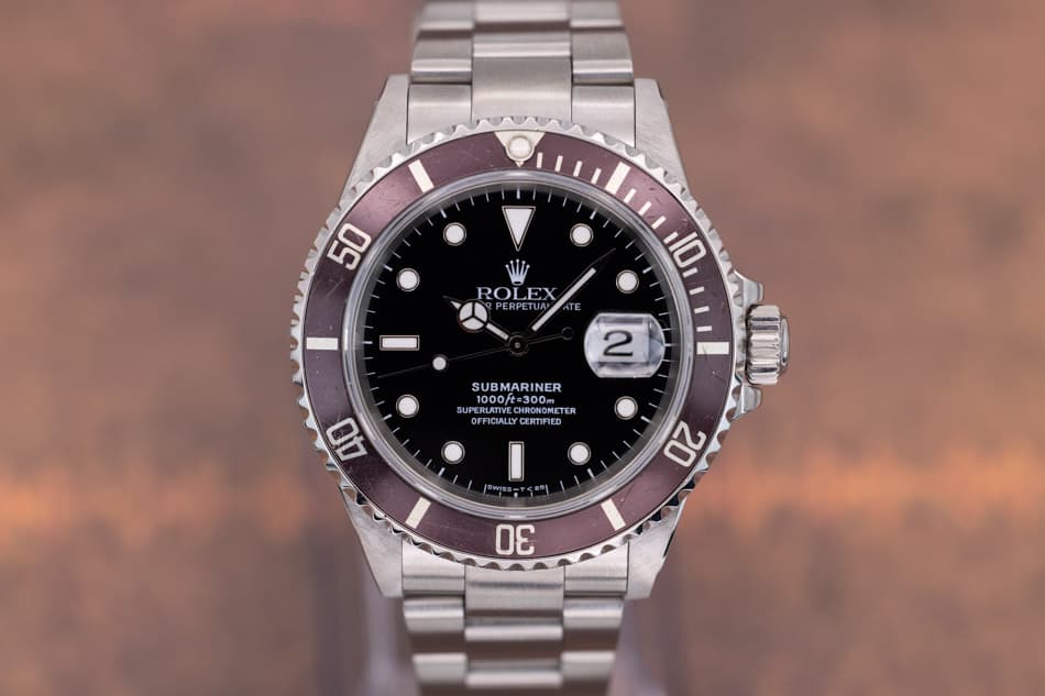 May be an image of wrist watch and text that says '50 ROLEX ROLEX 3 PERPET PERPETUAN PPE 10 TE 2 SUBMARINER 1000/t=300m 1000ft-300m CSAE 1000 1000ft=30 #300m UPERLATIVE UPERLATIVE…