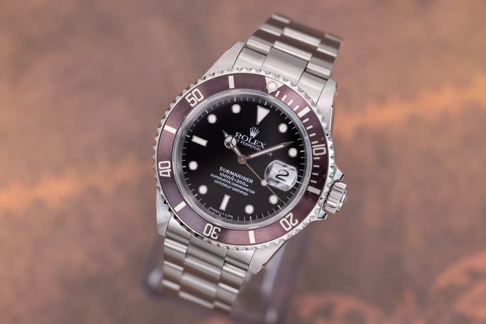 May be an image of wrist watch and text that says '50 50 ROLEX EETUAL PERPEX PERPETUAL 40 10 SUP 1000f OFFICIALD PERLATTVE 1000ft=300 SUBMARINER RINER CERTIRIED n CERTIFIED…