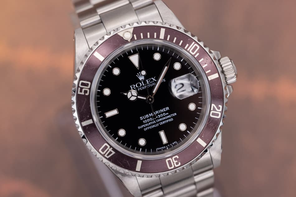 May be an image of wrist watch and text that says '10 TE E 50 ROLEX TUA PERPE 2 ARINER RONOMETER TER SUBM 1000 =300m CHRONOMET CHRONOMETEO PERLATIVE RCATYE PLN 1000 CERTIFIED SUP…