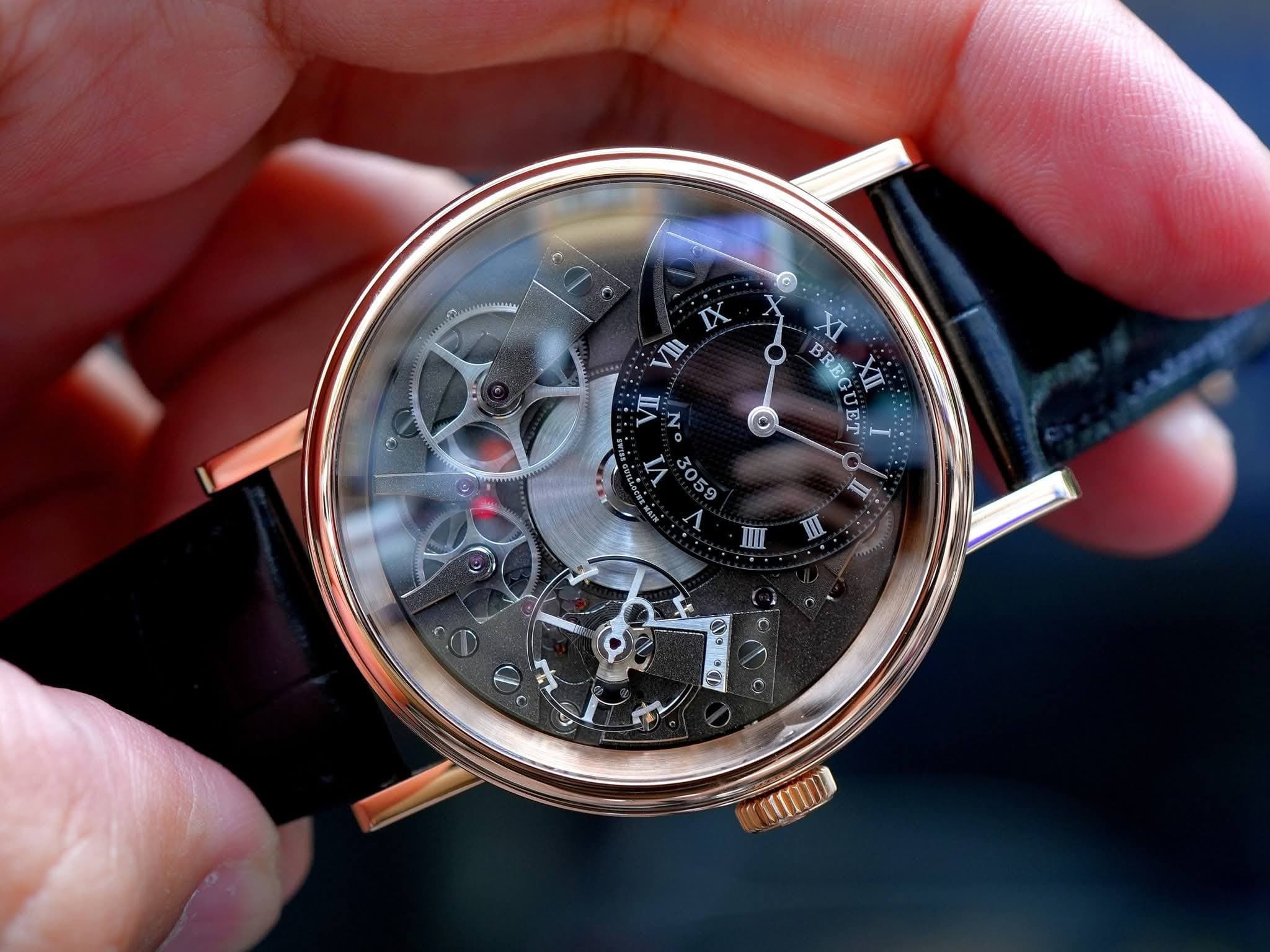 May be an image of wrist watch and text