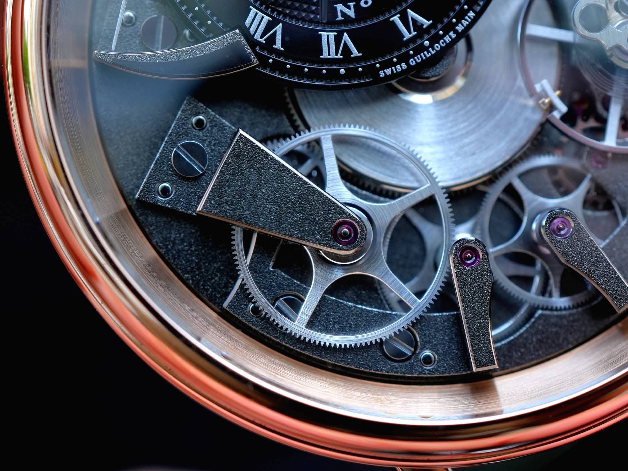 May be an image of wrist watch and text that says 'N n TЛ SWISS Ι GUILLOCHEMAIN MAIN GUILLOCHE'