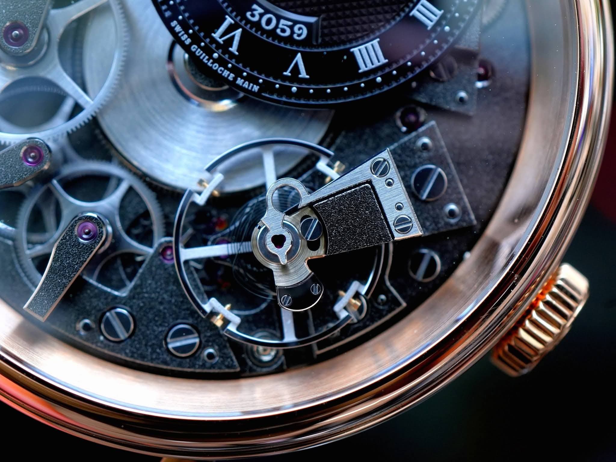 May be an image of wrist watch and text that says 'SWISS и 3059 GUILLOCREMAIN MAIN GUILLOCHE Λ'
