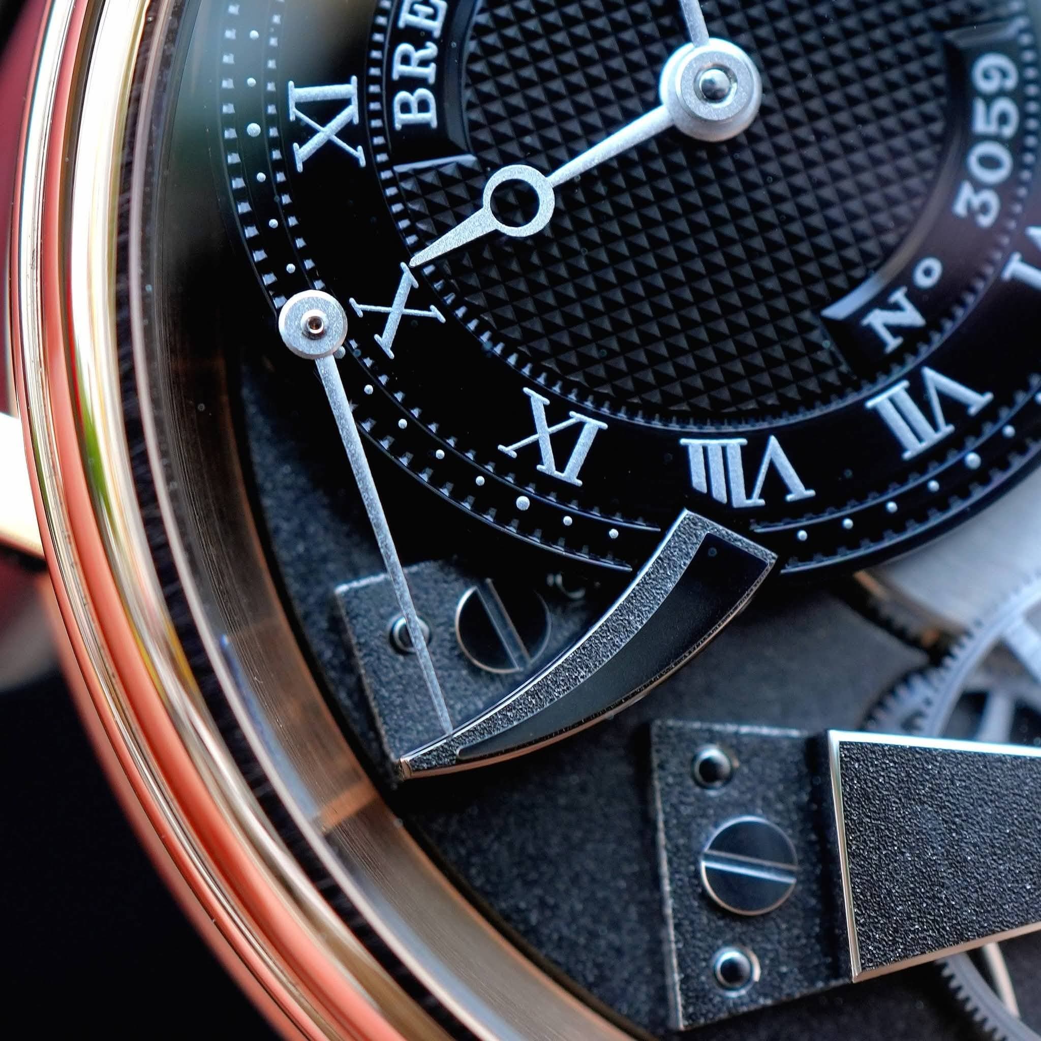 May be an image of wrist watch and text that says 'XT BRE E 905 N N nΑ XI'