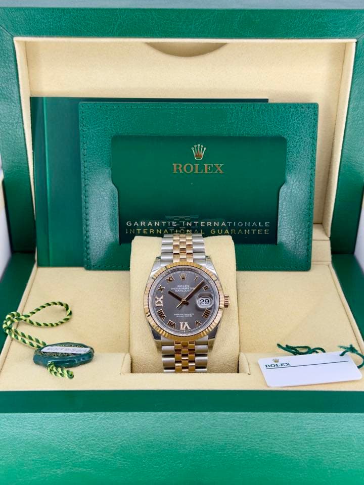 May be an image of wrist watch and text