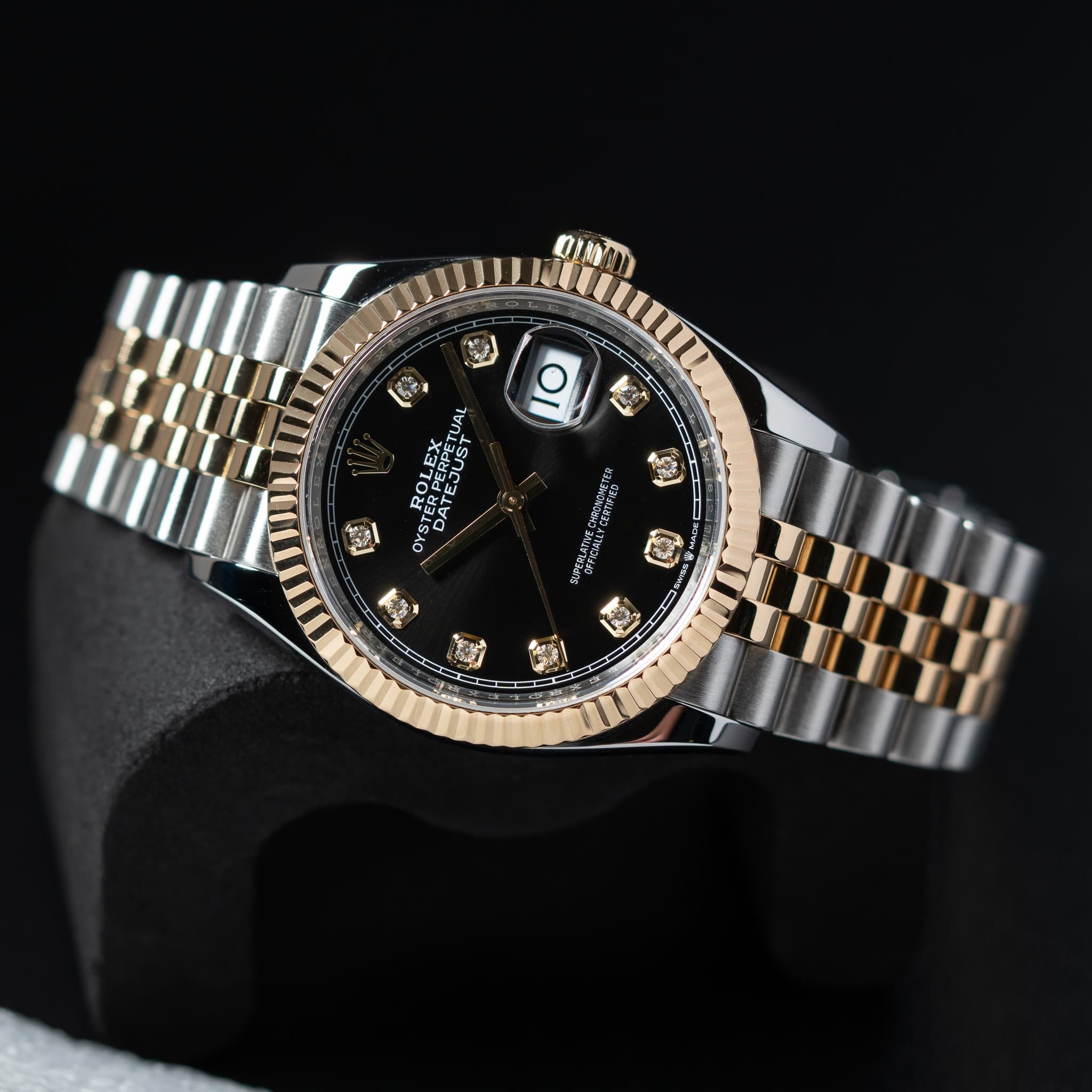 May be an image of wrist watch and text