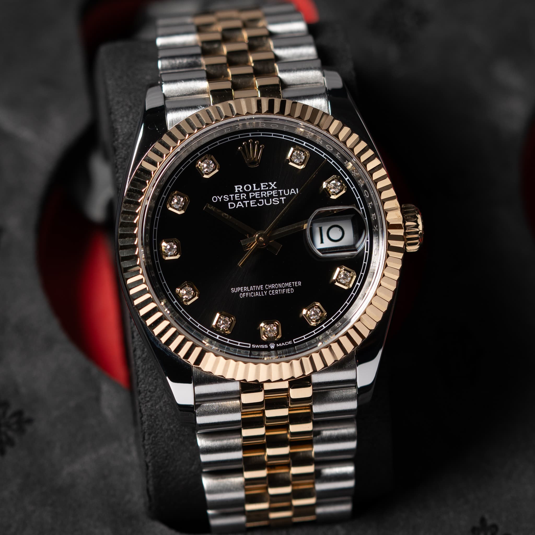 May be an image of wrist watch and text
