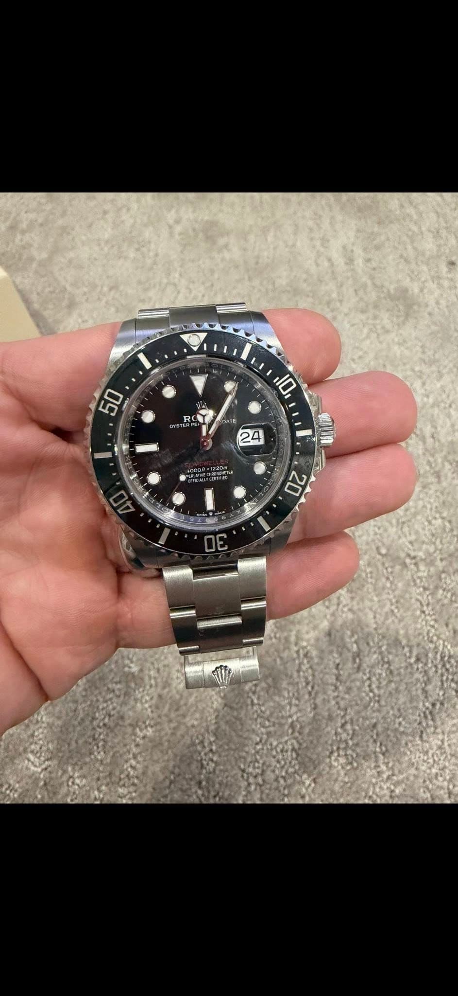 May be an image of wrist watch and text