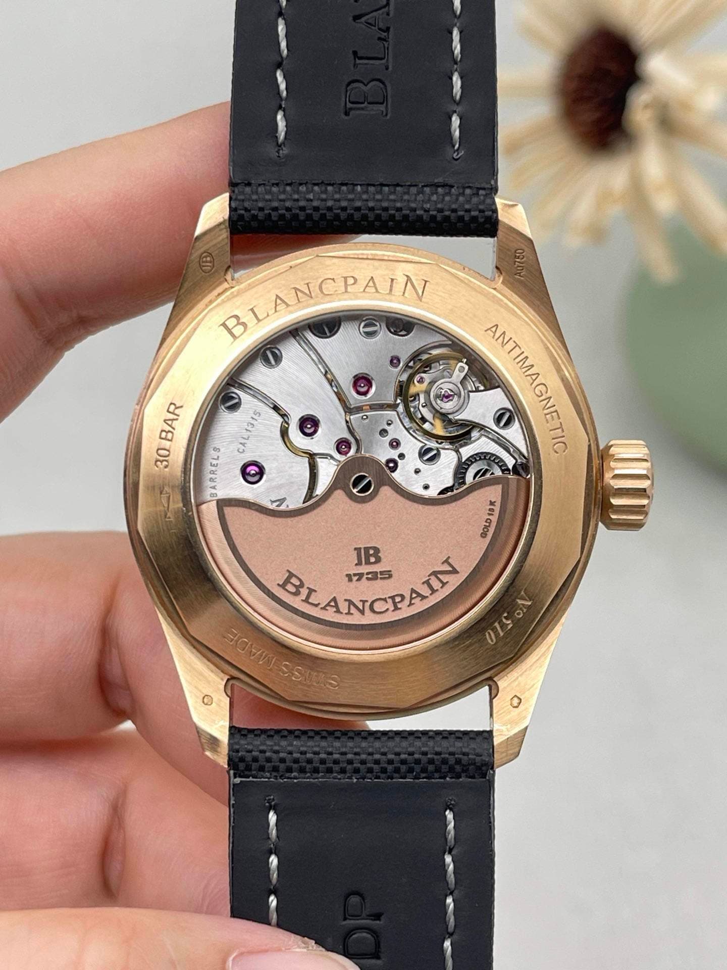 May be an image of wrist watch and text that says 'BLANCPAIN BAR AL1315 315 30 BARRELS O ANTIMAGNETIC GOLD19K GOLD ហា០ JB 1735 BLANCPAIN AIN SAREESSING MAVD SSIRS OISON'