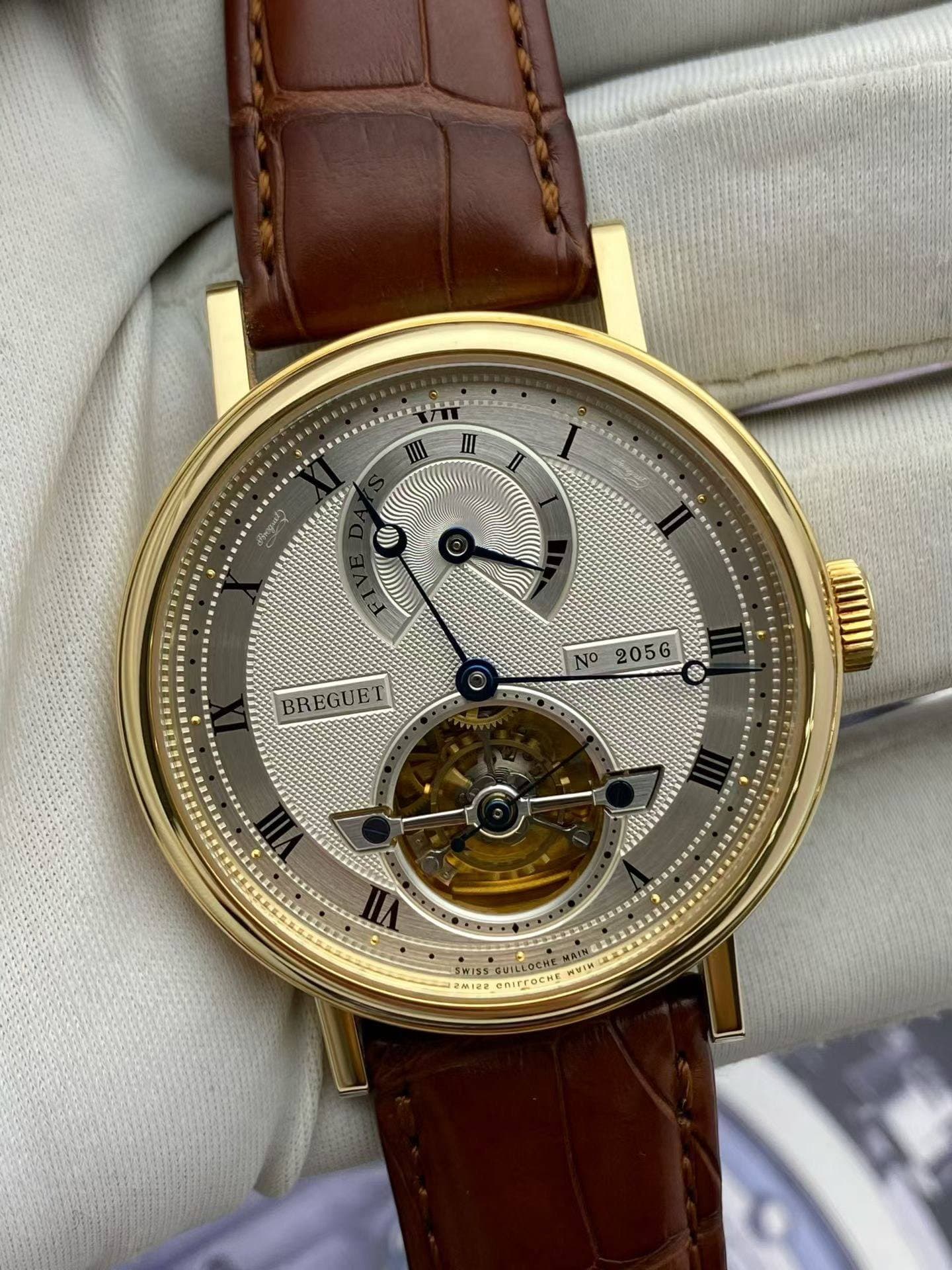 May be an image of wrist watch and text that says 'III II II A BREGUET N2056 NO 2056 SW155 พยาท 26.108 OCHE'