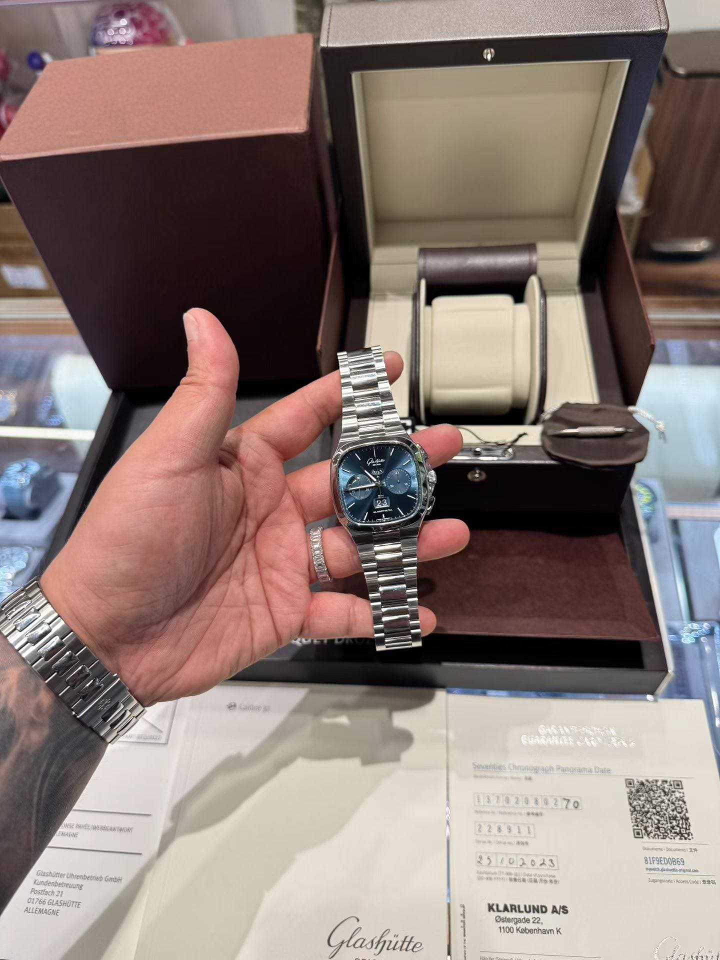 May be an image of wrist watch and text