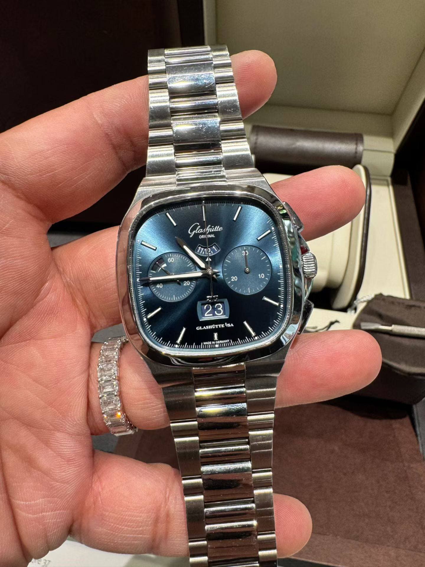 May be an image of wrist watch and text