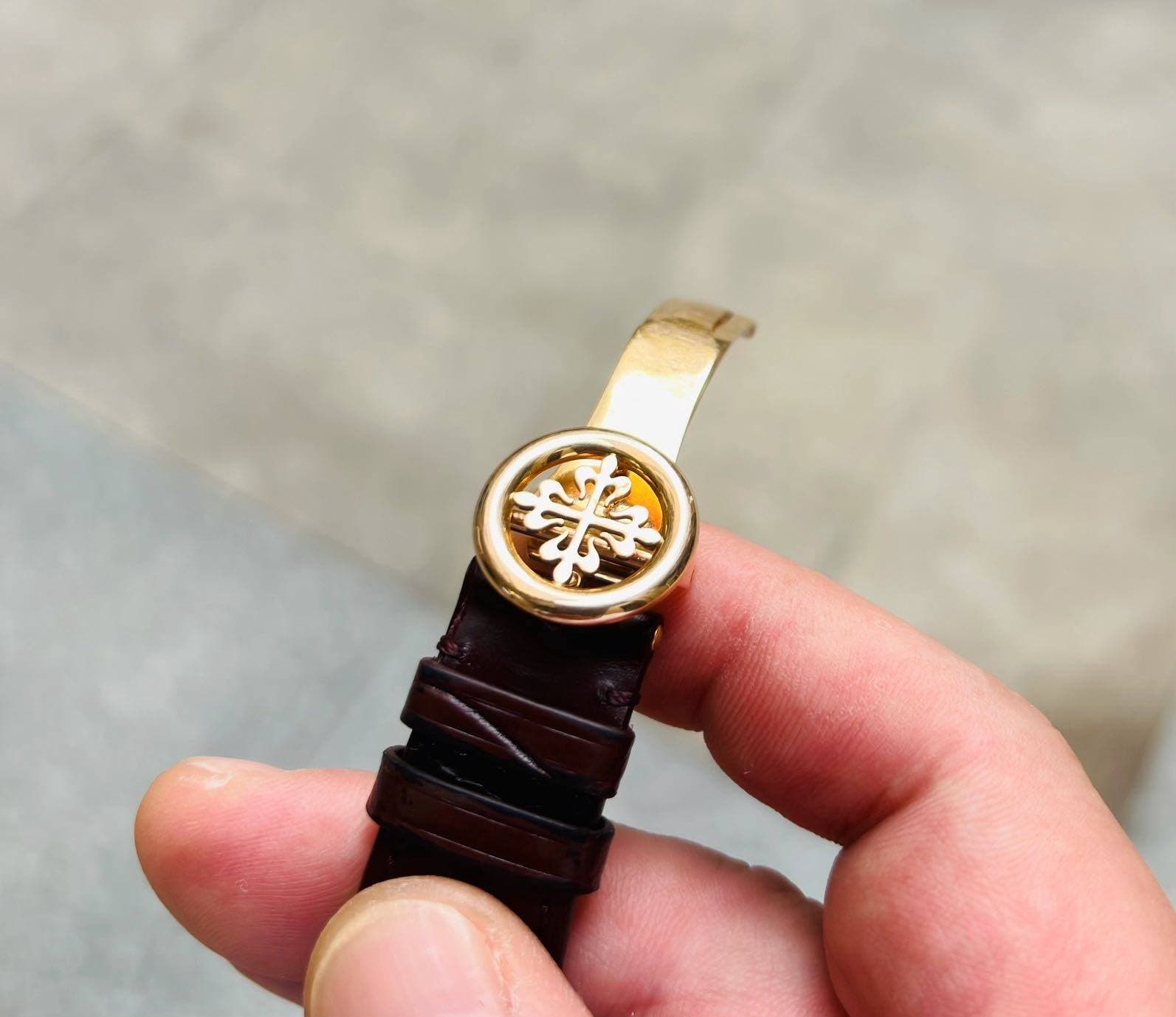 May be an image of wrist watch and leather
