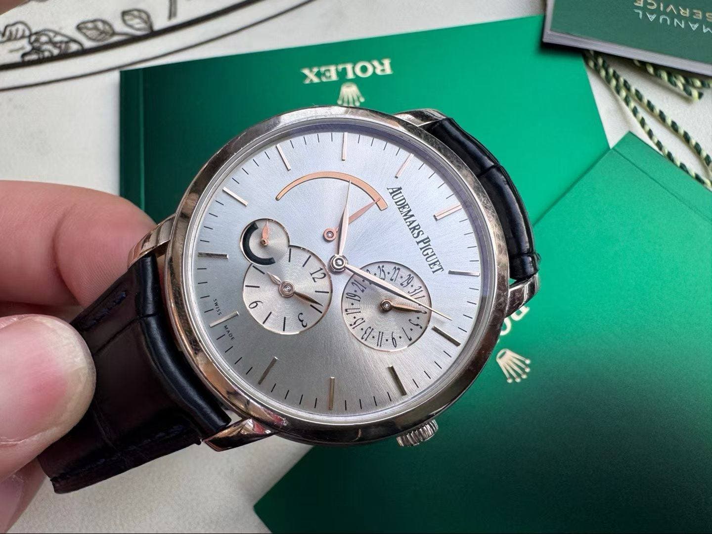 May be an image of wrist watch and text