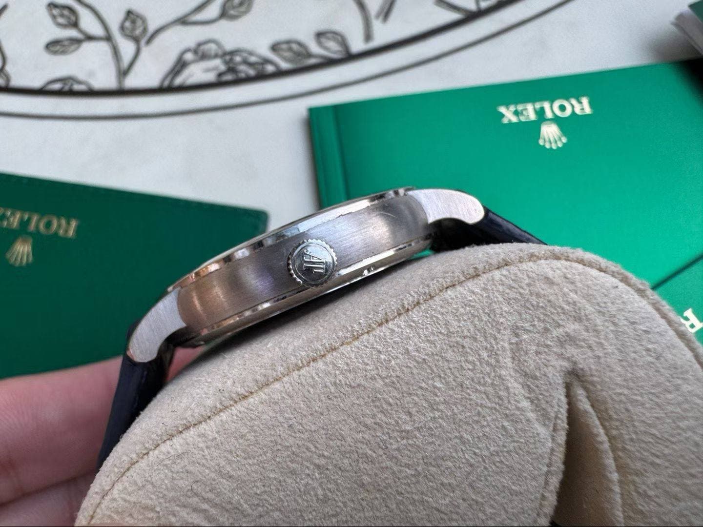 May be an image of wrist watch, ring and text