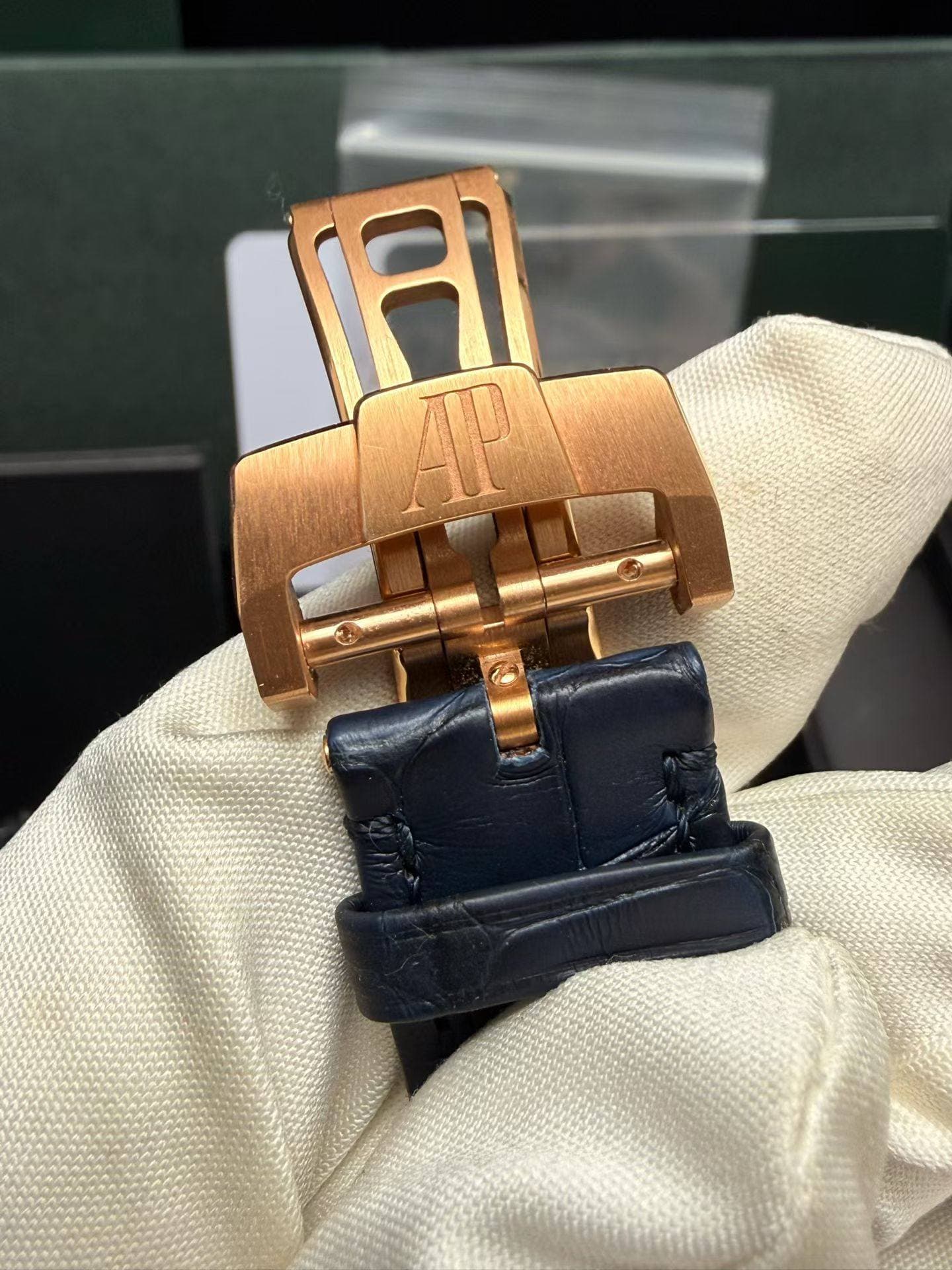 May be an image of wrist watch and saddle-stitched leather