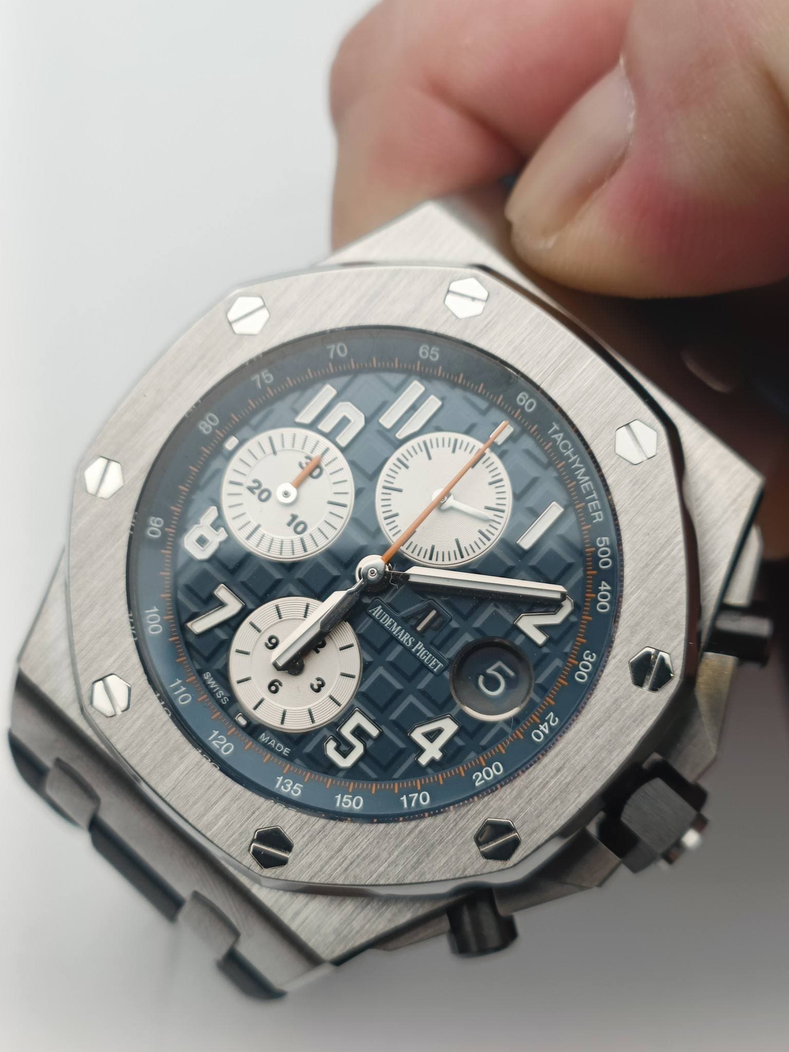 May be an image of wrist watch and text