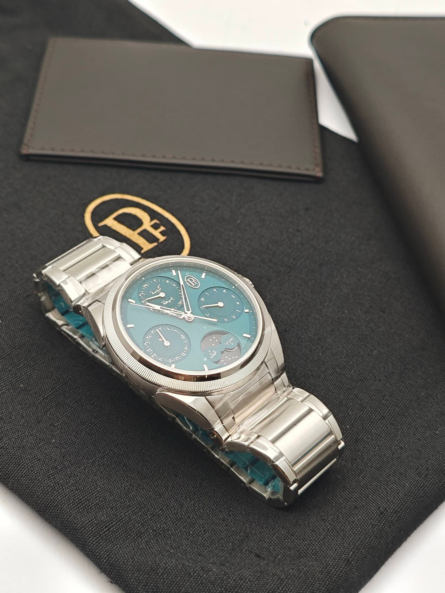 May be an image of wrist watch and text